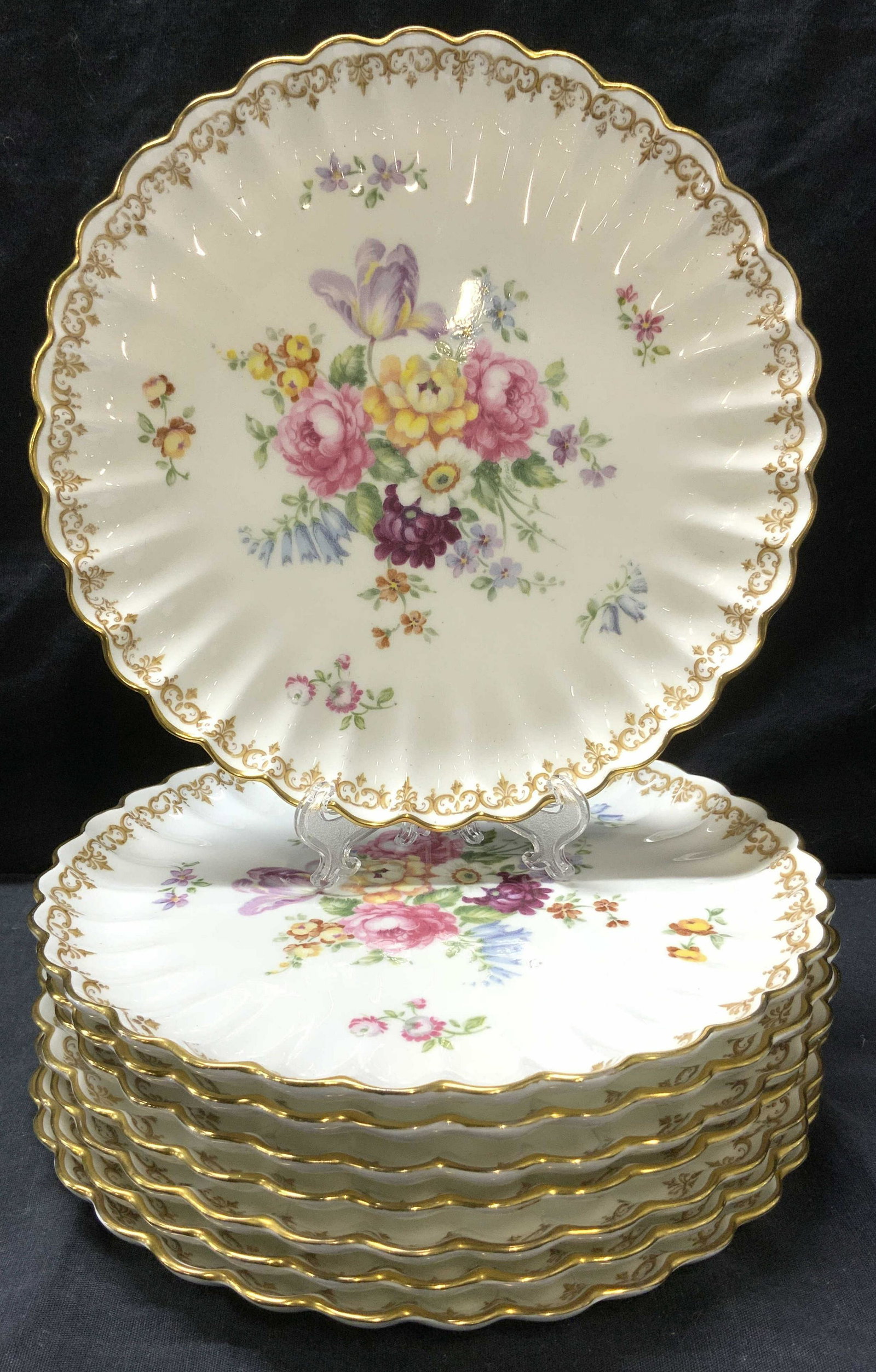 STAFFORDSHIRE Set 8 Fine Bone China Plates ENGLAND: STAFFORDSHIRE Englands Bouquet Set of 8 Fine Bone China Plates, made in England, each plate has floral motif and gilded edges, measures approx 8 3/4 in. diameter. Verso reads Fine bone China crown Sta