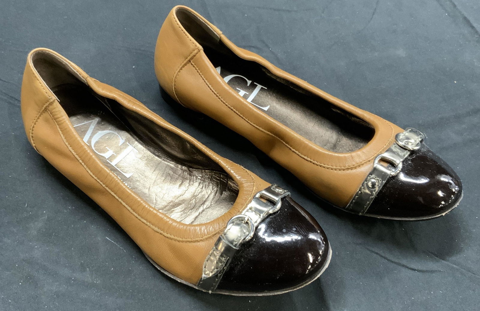 AGL Tan Leather Ballet Flats, ITALY: Signed Luxury designer ballerina shoes, ATTILIO GIUSTI LEOMBRUNI Made in Italy, silky tan leather and black patent leather with silver patent leather buckle. Size 37. Style no. D 558034 Leather baller