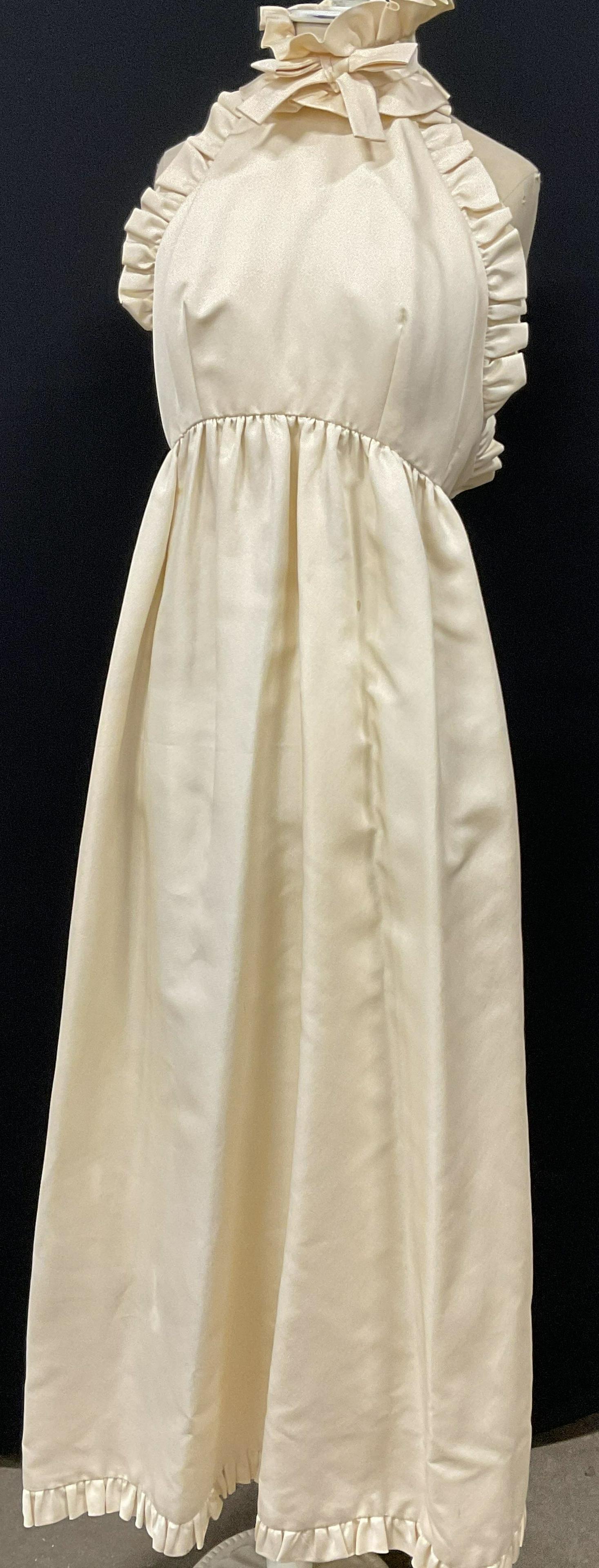 GEOFFREY BEENE Peach Halter Top Dress: GEOFFREY BEENE peach colored halter top dress. Measures approx under breast, 14 inches, waist measures 24 inches. Neck measures approx 14 inches, length of dress from shoulder seam to bottom 54 inches