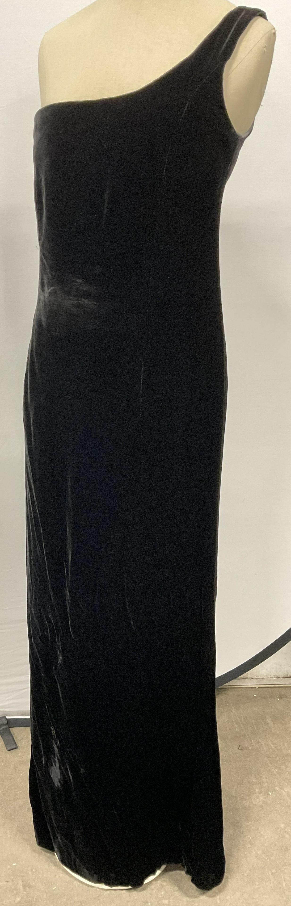 Giorgio ARMANI Black Velvet Dress, Italy: ARMANI Black velvet dress. Tag reads Giorgio Armani Made in Italy size 12. Bottom slit to back of dress. Waist of Dress in photos held by clip to show a more fit look. Some wear to dress. ARMANI Dress