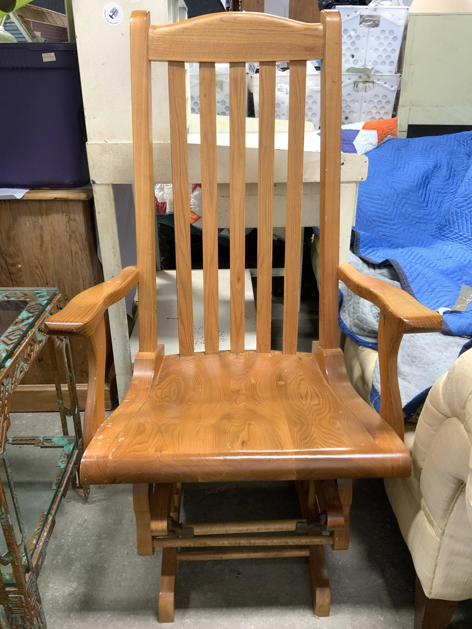 Vintage Wooden Rocking Chair: Rocking chair is vintage and wooden. Piece is tan toned Piece measures approx 48 inches tall 27 inches wide 27 inches deep. Chair, vintage chair, rocking chair, wooden chair, homewares, home furnishin