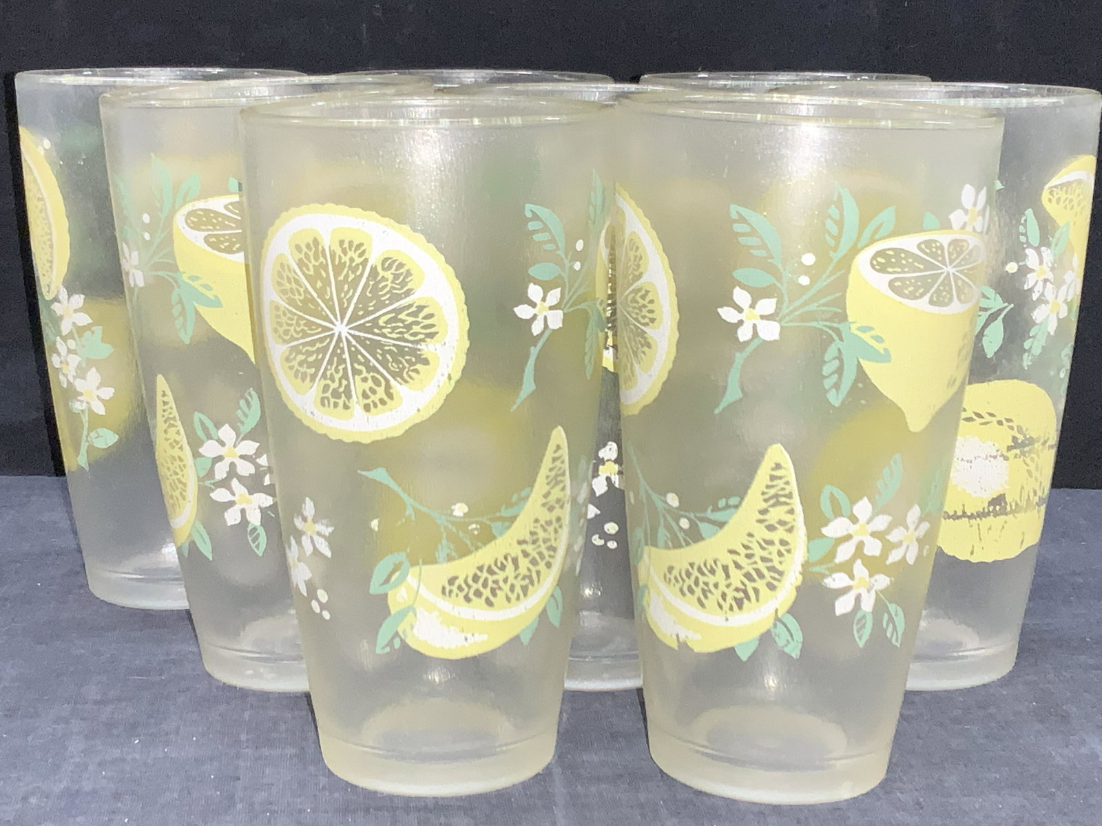 HJ STOTTER INC Set8 Lemon Motif Cups, Barware: 8 composite drinking cups with lemon motifs on the exterior of the cups. Approximately 5.75 inches tall. Marked on undersides HJ Sotter Inc, NY, USA. HJ stotter inc cups, drinking cups, lemon motifs, 