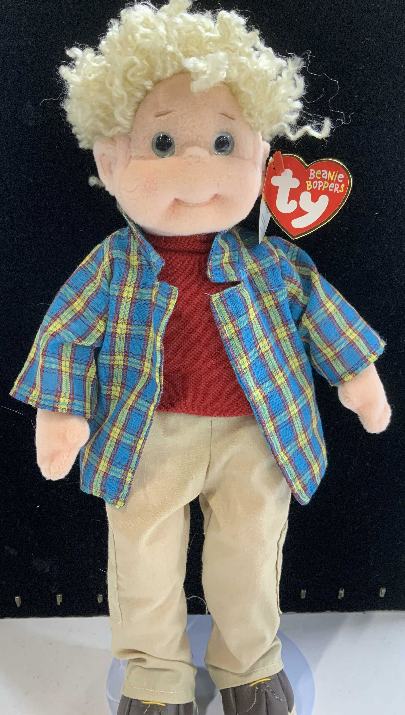 BEANIE BOPPERS Rugged Rusty Doll w Stand, Tag: Part of the Beanie BOPPERS Series is TYs RUGGED RUSTY, c. 2002 the doll is dressed in red shirt, blue plaid jacket and khaki pants with brown shoes. Original tag still attached to doll, 13 in. Ht. Met