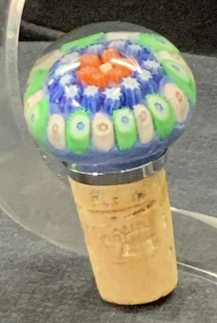Millefiori Art Glass & Cork Bottle Stopper England: 1.75 in. W mushroom shaped Millefiori art glass stopper head with cork stopper. Cork is stamped made in England Chrome hardware prevents cork from crumbling. 2.5 in. Long Barware Accessories, wine bot