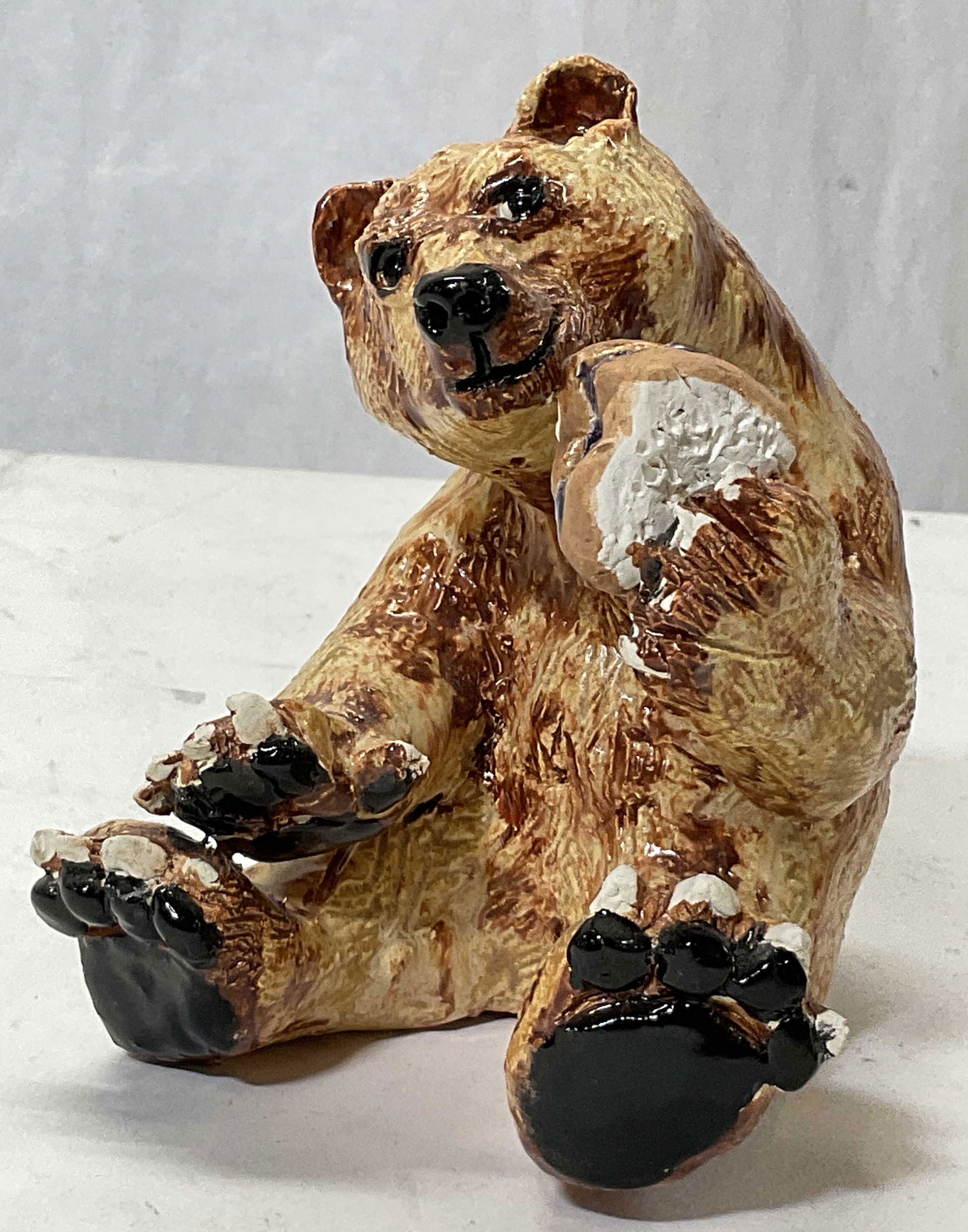 Ceramic Bear W PB&J: Ceramic Bear eating pb&j. Measures approx 5.5 x 5 inches. Some surface wear to piece consistent with age. Chipping to some parts of bear. Bear, ceramic wear, decor, decorations, ceramic ware, shelf we