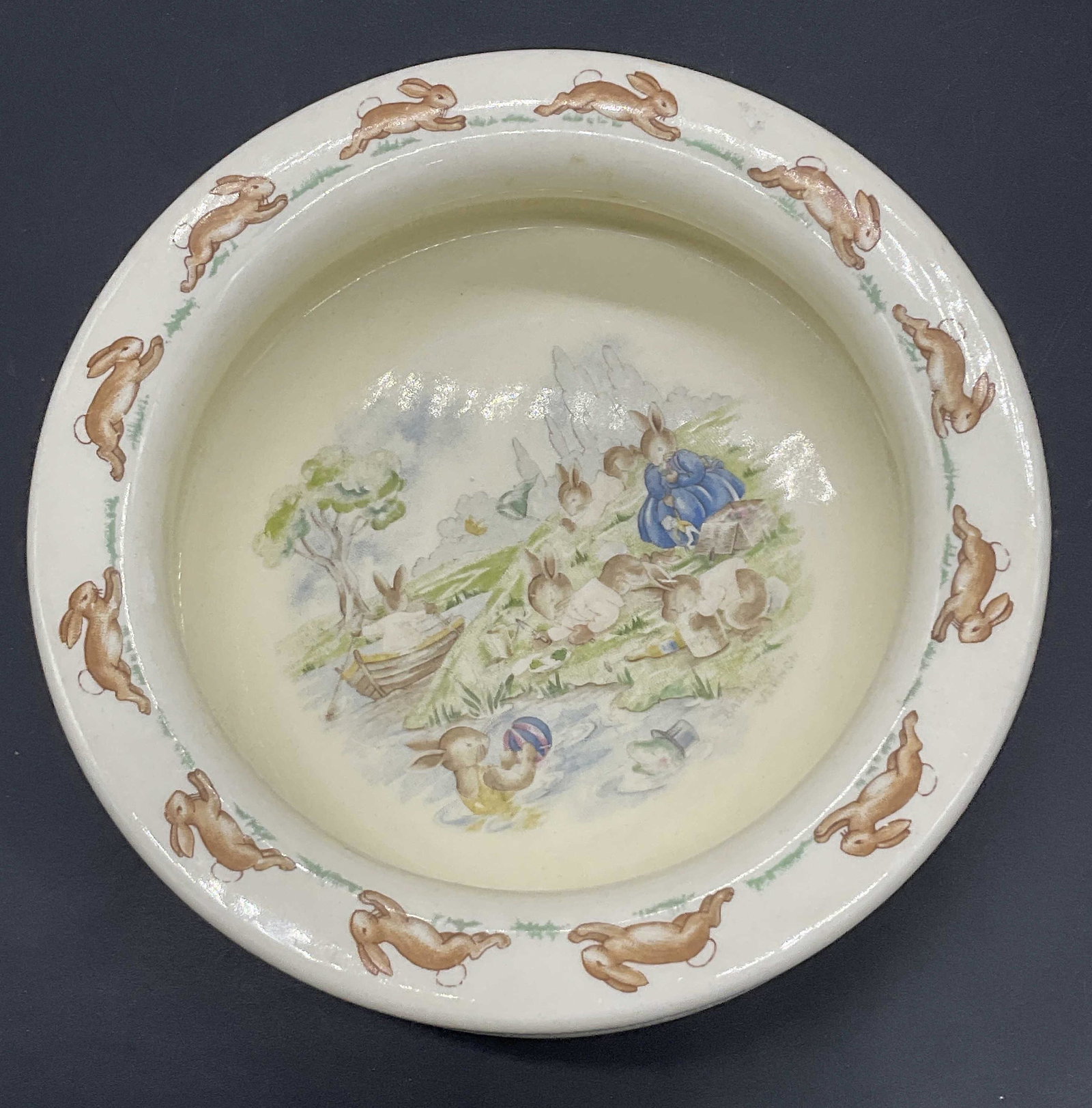 Vintage Bunnykins Royal Dalton Side Bowl: Vintage Bunnykins Heavy Bowl Royal Dalton Bone China England Playing on the River Wavy Side Bowl. Stamped on bottom with ROYAL DALTON. Measures approx 6 x 1.5 inches. Some wear to piece consistent wit