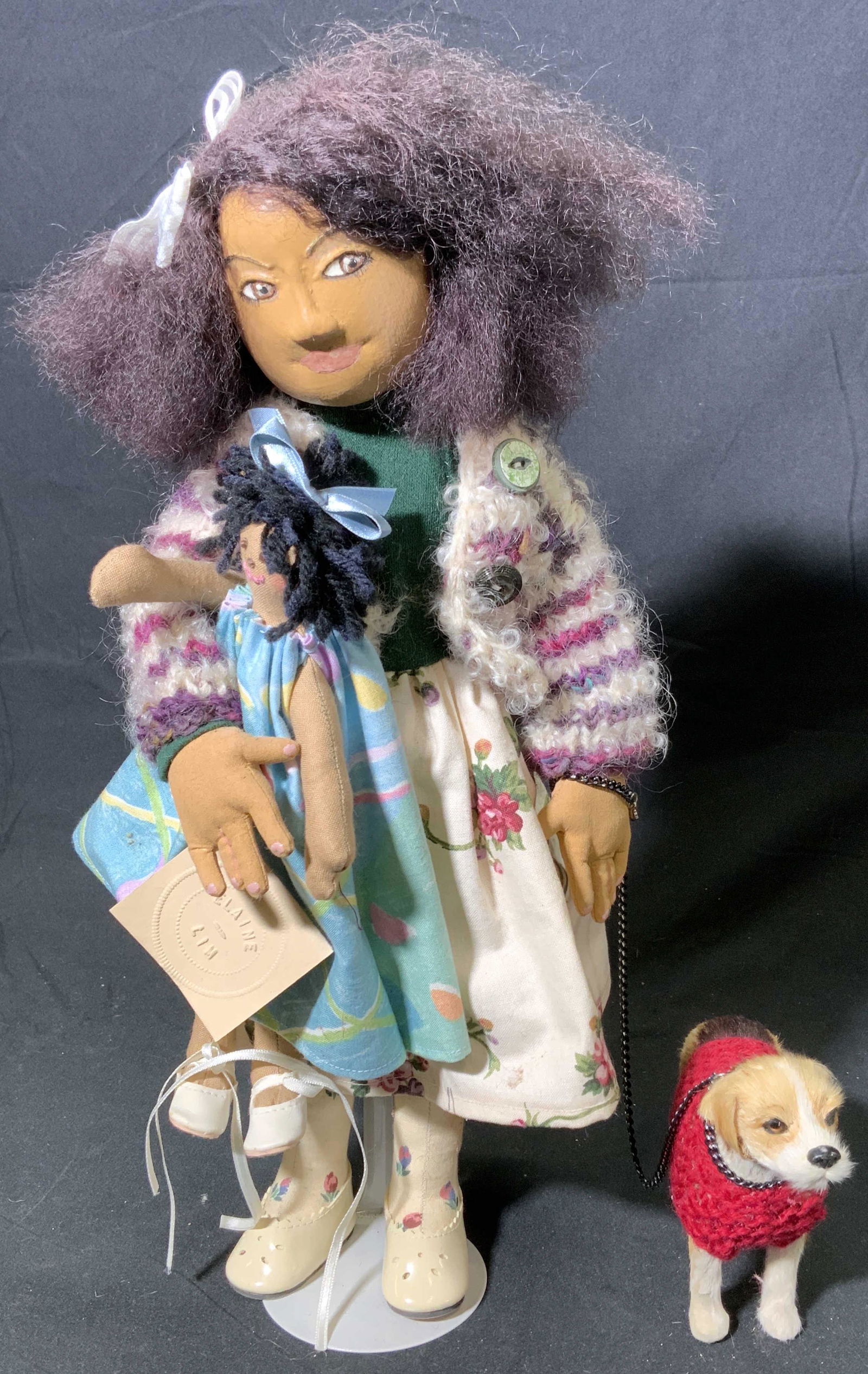 ELAINE LIM Best Friends Artist Doll: Vintage ELAINE LIM collectible artist doll. Dark Skin painted fabric doll in purple sweater and floral dress, Carries doll and has dog on leash. Tag reads Contemporary Fabric Doll, One of a Kind Serie