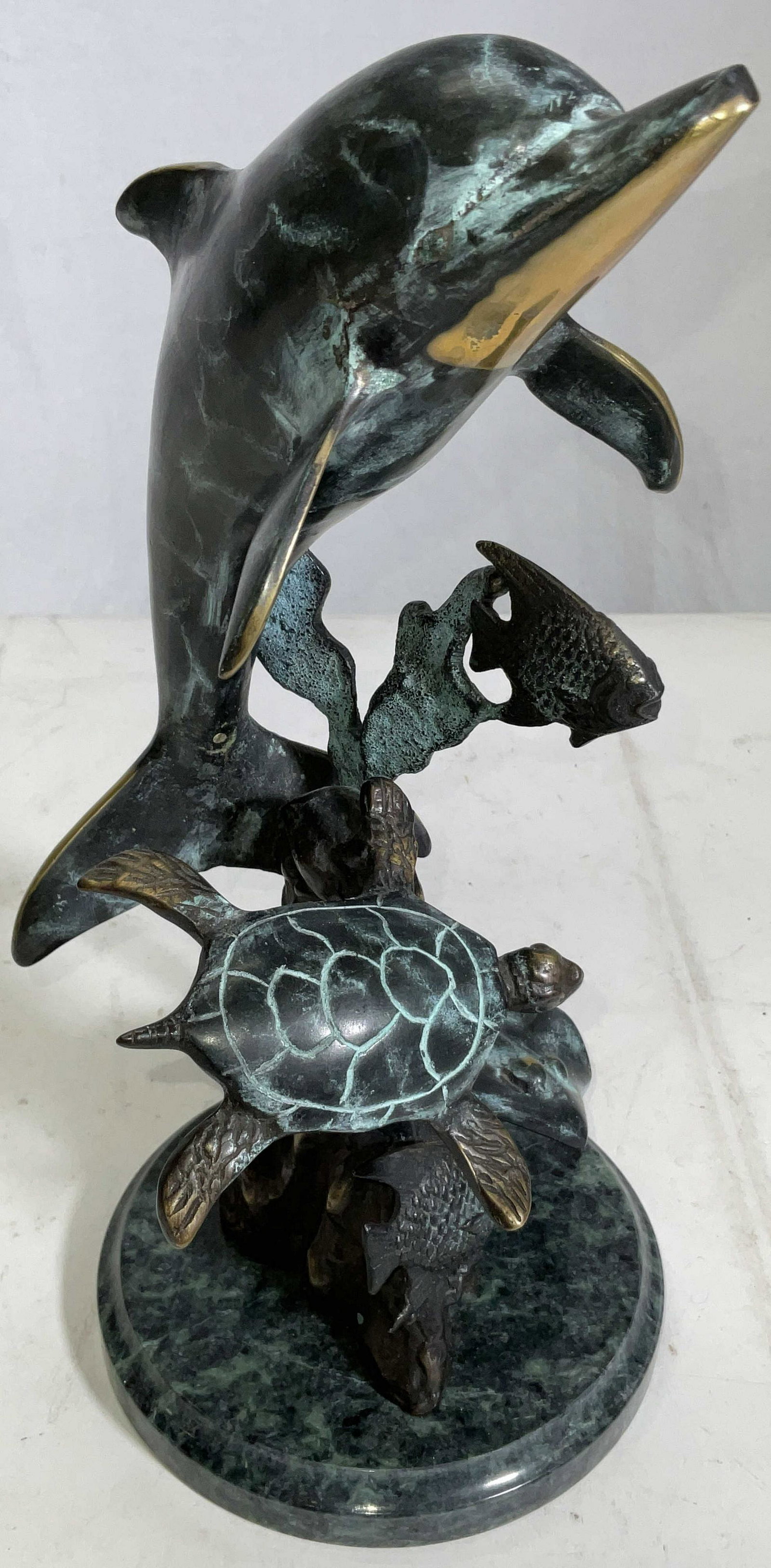 Handmade SPI Mini Brass Seaworld: Hand sculpted and casted into brass. Lost wax method has been used to create all the detail within this piece. Piece depicts brass dolphin, sting Ray, turtle and fish mounted to a marble base. Differe