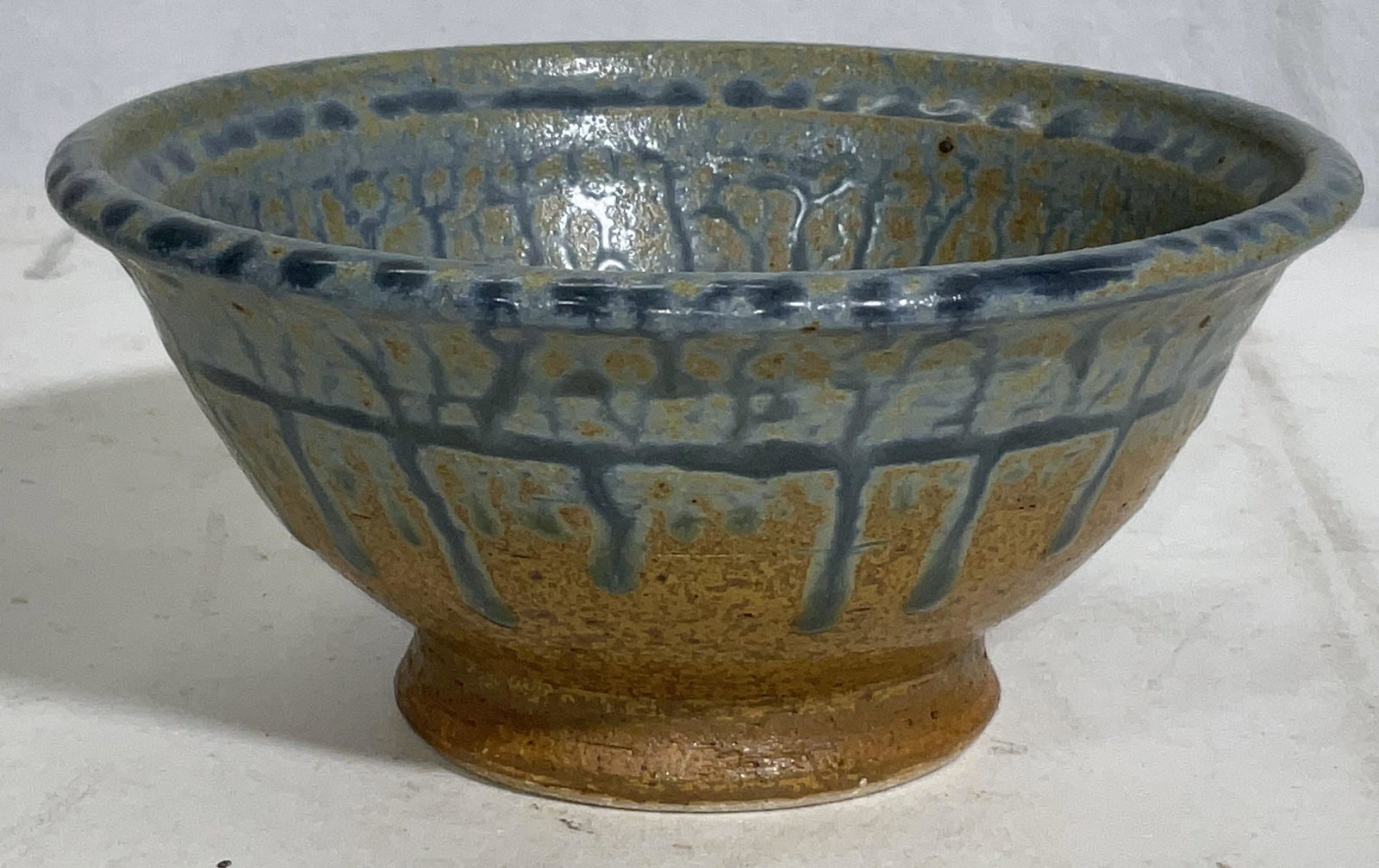 Ceramic Salt Glazed Bowl: Earth toned ceramic bowl. natural salt glazing to piece. Diameter measures approx 6.5 inches x 3H inches. Surface wear consistent with age and use. Ceramic wear, earthenware, kitchenalia, ceramic bowl
