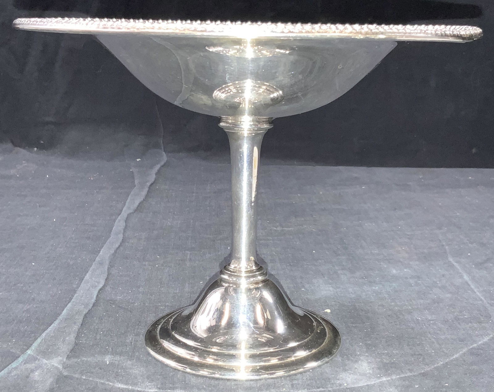 WM Rogers Silver Plate Taza: A silver plated footed taza with braided pattern on rim. Marked Wm Rogers on underside, approximately 5.25 inches tall. Evident residue. Wm Rogers silver plated taza, footed taza, silver plated taza,