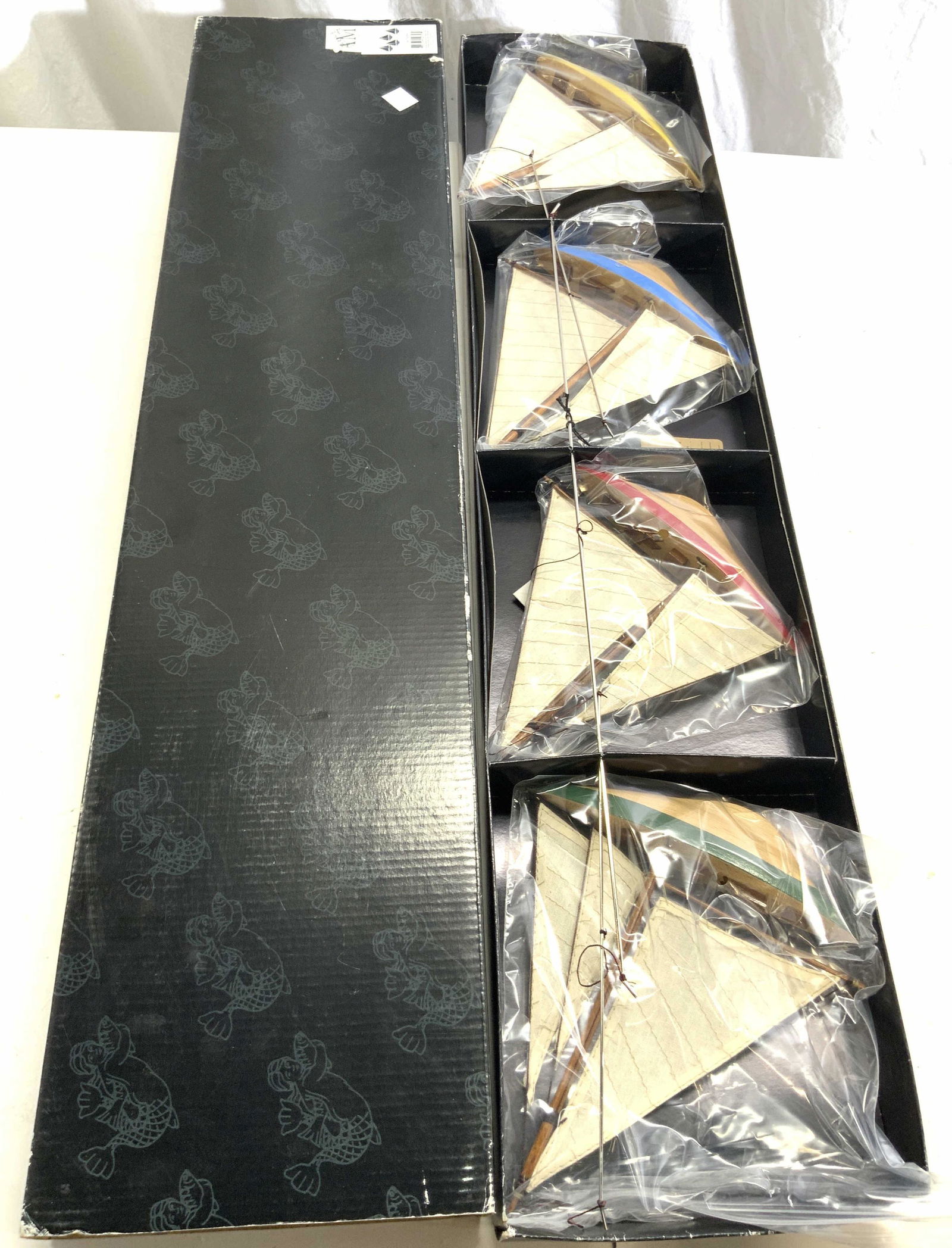 AM COUNTRY WILLOW A-CUP MOBILE Ship Mobile: A ship mobile contained in its original packaging. Sticker to exterior reads AM, brand name partially worn, can read MODELS. Interior tag reads CPU TRY WILLOW A-CUP MOBILE. Mobile is comprised of ship