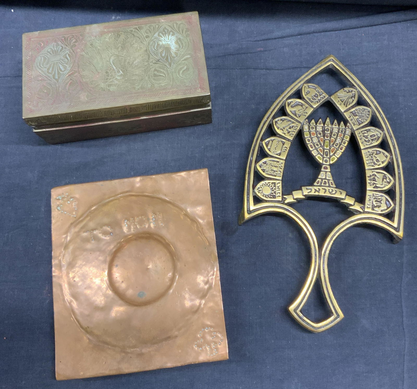 Lot 3 Metal Judaica Decor: Lot 3 Metal Judaica Decor, includes box, a footed coaster stand, and a panel, footed stand measures 9 inches long. Metalware, Judaica, Judaica Metal, metal Judaica decor, lidded box, footed coaster st