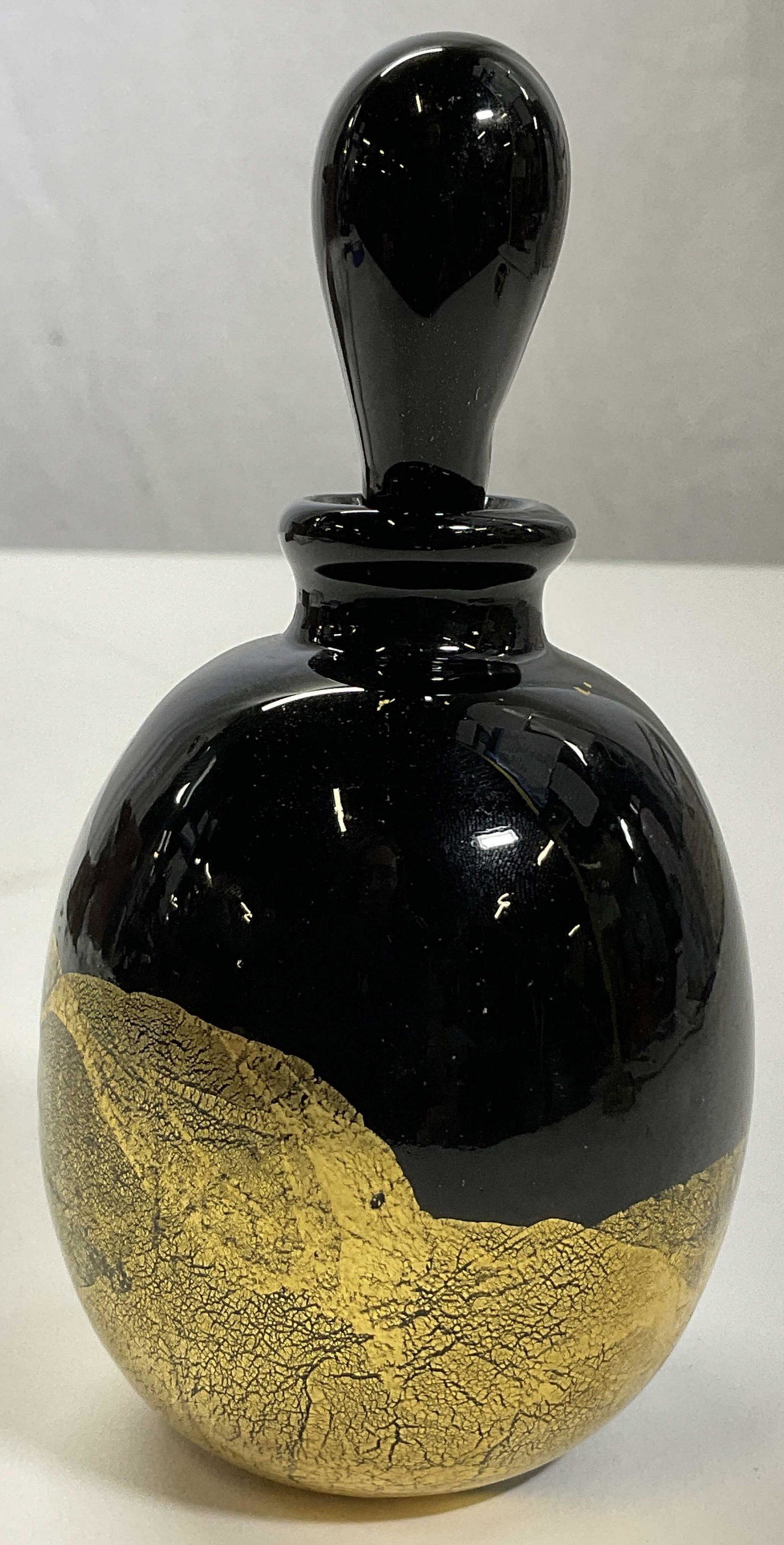 GLASS ACT Perfume Bottle W Gold Detail: GLASS ACT Perfume Bottle W Gold Detail. Bottom sticker read Glass Act, Made in Taiwan. Dark glass, with gold detail to piece. Surface wear consistent with age and use. Measures approx 3 x 5.5 inches. 