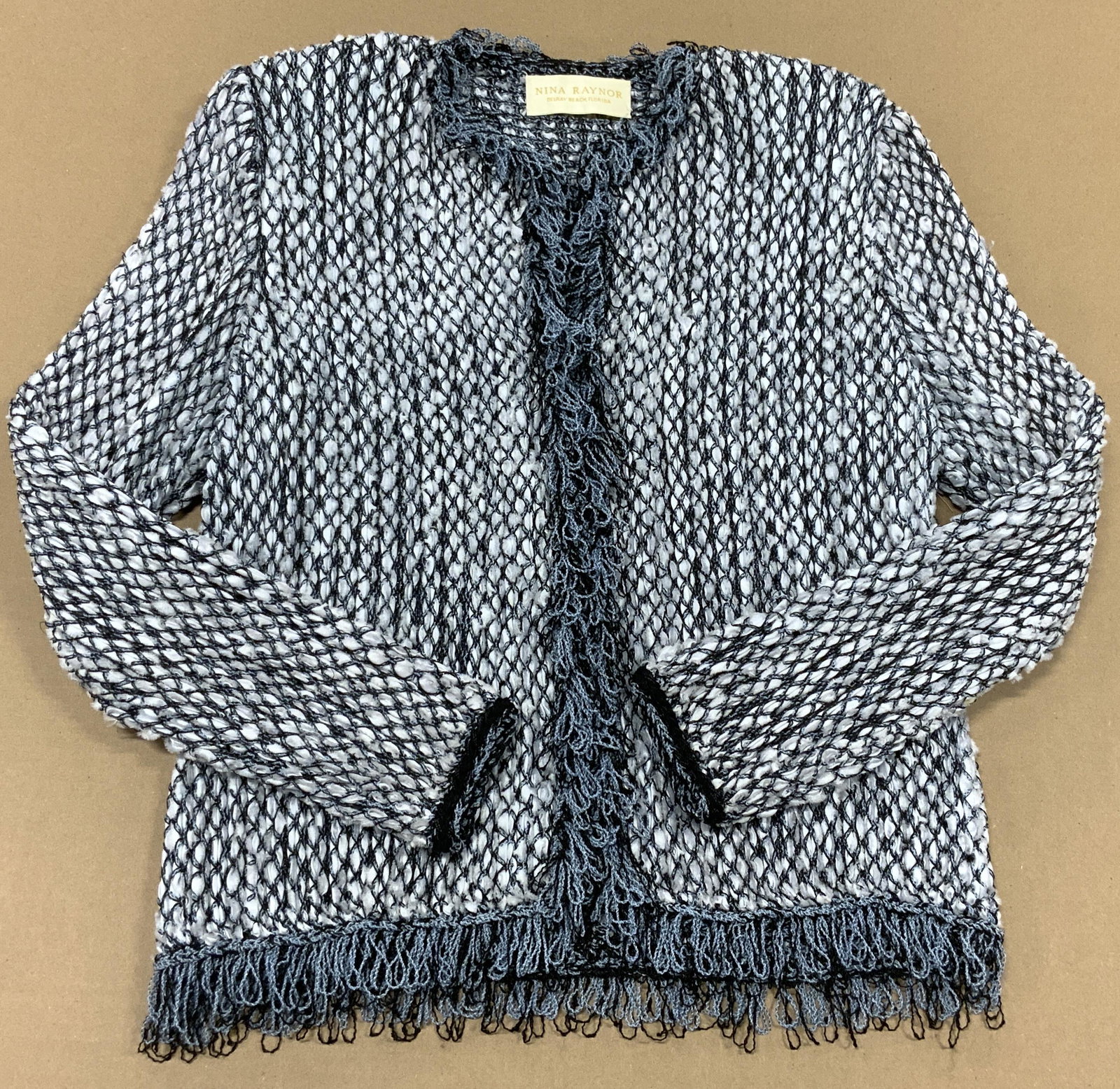 NINA RAYNOR Boutique Blazer, Delray Beach: NINA RAYNOR DESIGNER Blazer, grey and white yarn. based out of Delray Beach, FL. Looped tassel shawl collar and fringe hem. Miscellaneous fabrics- see picture of label. hook and loop buttons, sewn in 