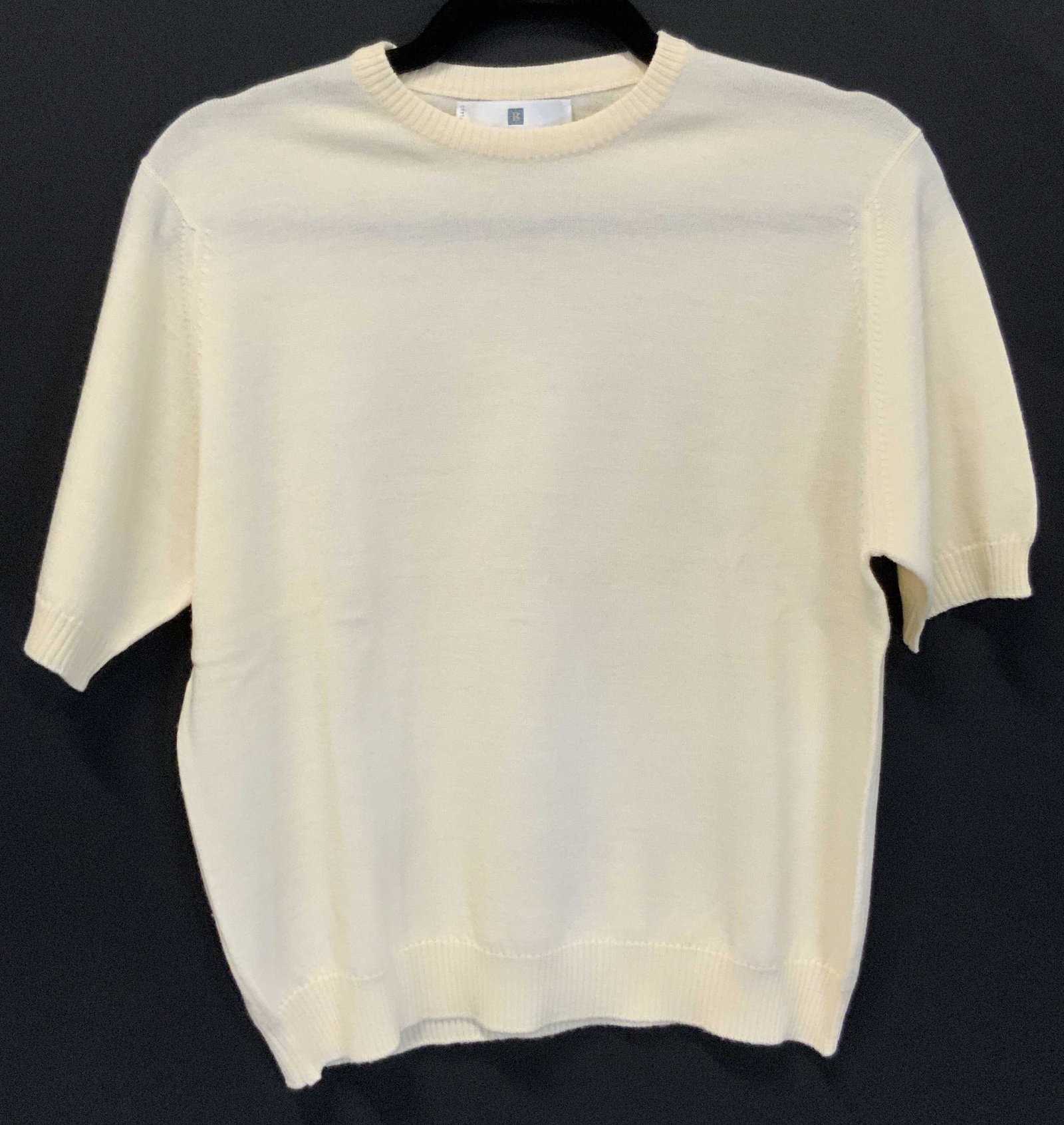 BALLANTYNE Merino Pure New Wool Sweater: A cream hued short sleeved merino wool sweater. Tag reads BALLANTYNE Merino Pure New Wool, MADE IN SCOTLAND. No size tag. Fits Approx small / medium. Length measures approx 22 inches. From brand websi