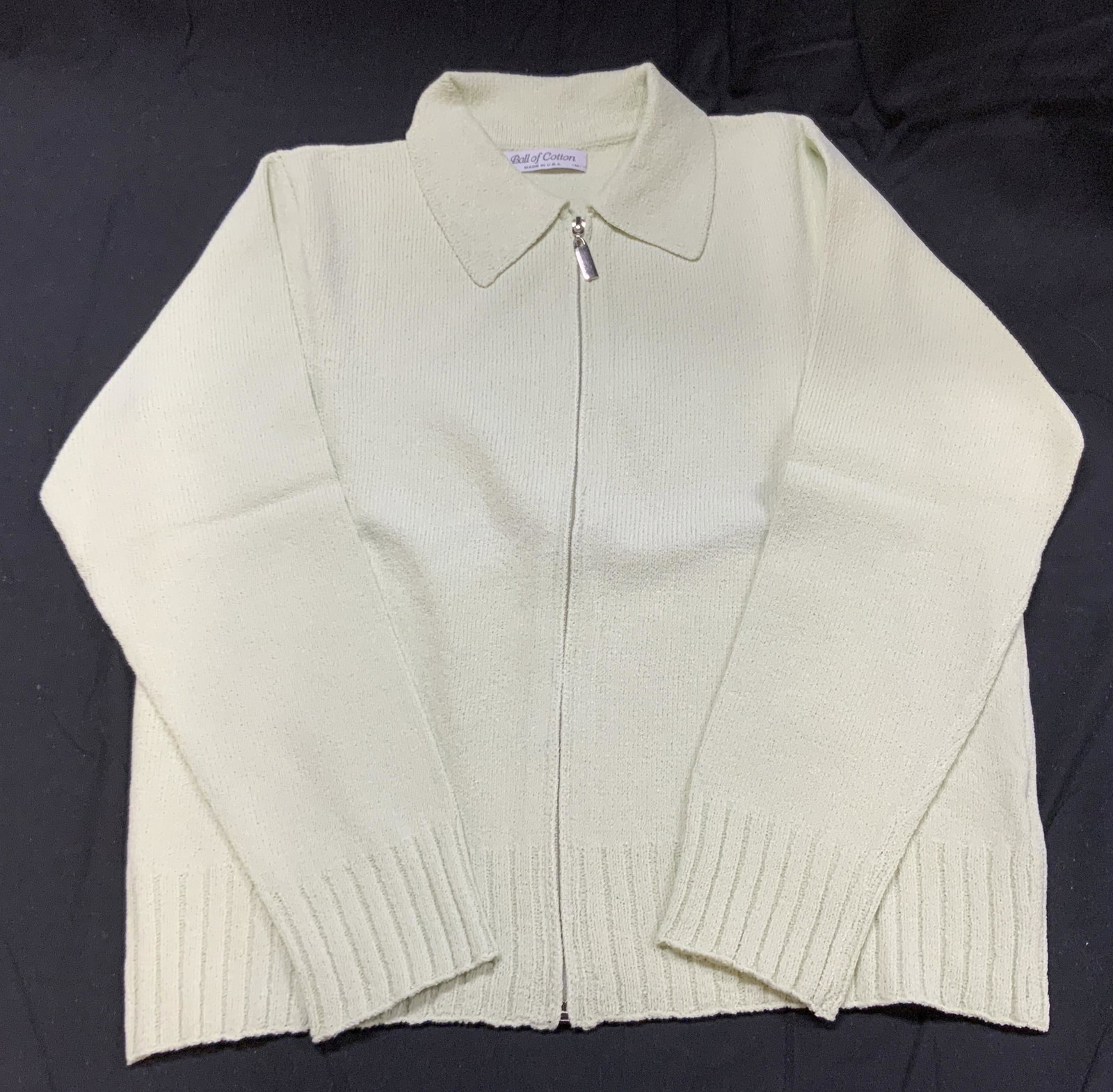 BALL OF COTTON Sage Collared Zip Up Sweater: Ball of Cotton collared long sleeve zip up sweater in sage green. Marked size M. Viscose and elite blend. Made in USA. In good condition, possibly never worn. Founded in 1991 by Elizabeth and Eddy Par