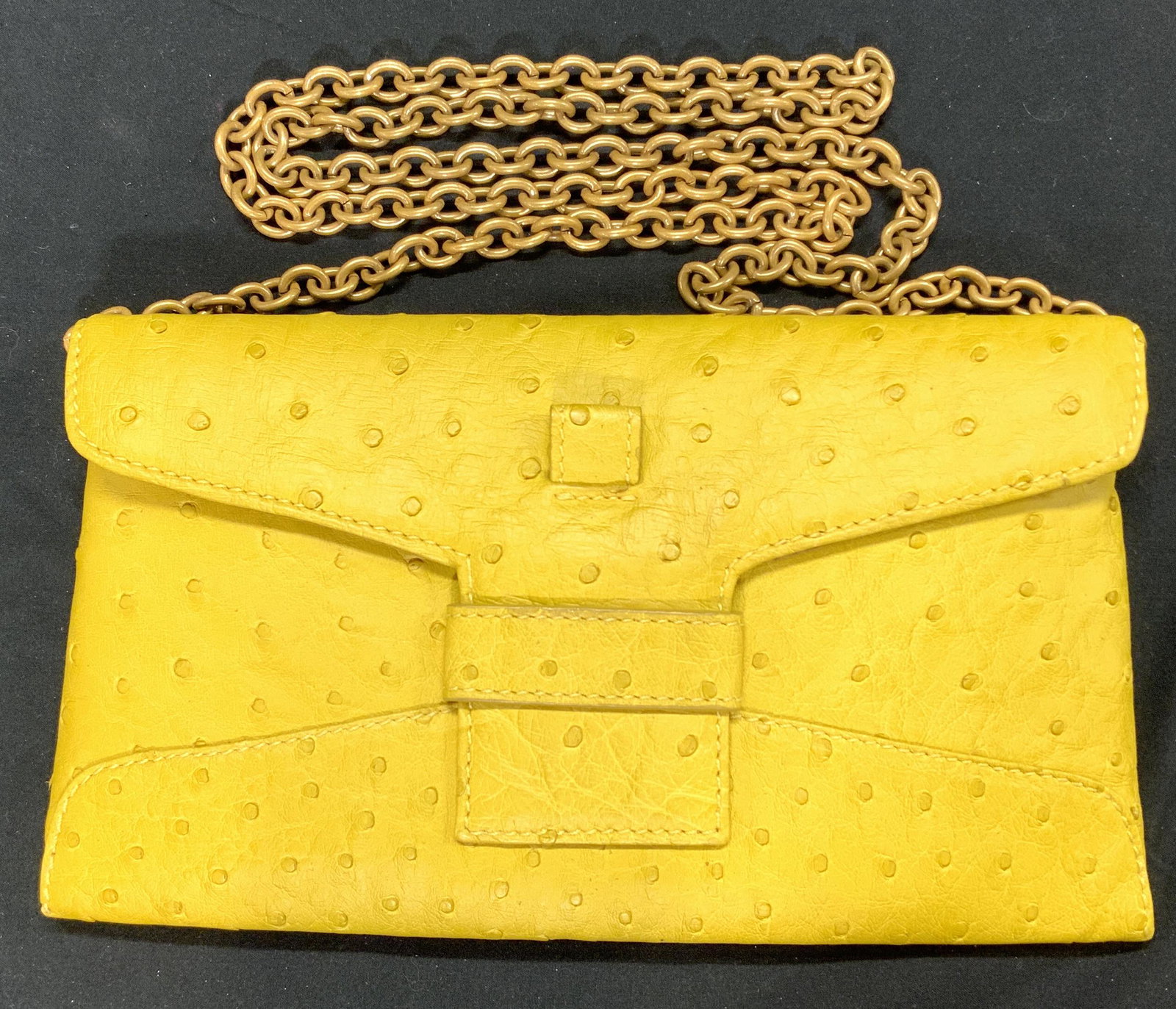 VICTOR HUGO Convertible Ostrich Shoulder Bag: Victor Hugo genuine ostrich Leather shoulder bag in lemon yellow. Gold tone removable chain. Can be converted into envelope style clutch purse. Interior lined with microfiber and goat leather blend. O