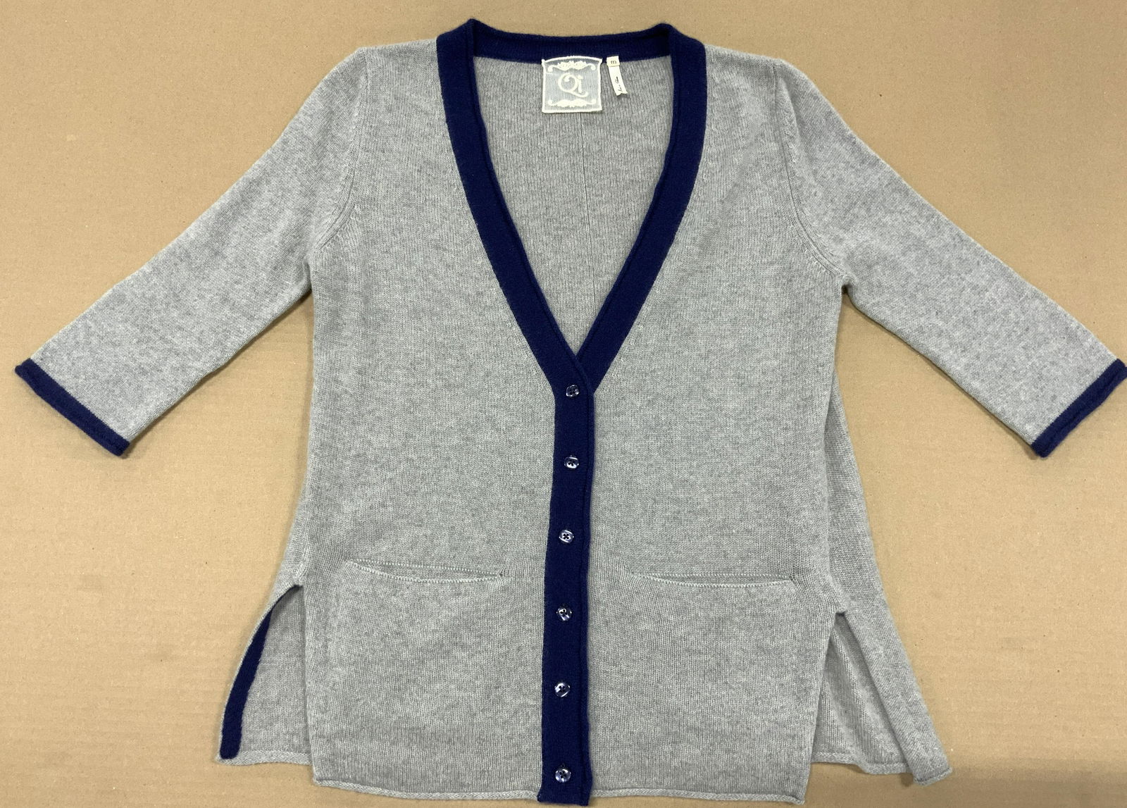 QI Cashmere Knit Cardigan: QI Cashmere Knit Cardigan, labeled ladies size M, grey and royal blue, 3/4 sleeve, double hand pockets, button closure, possibly never worn. QI Cashmere knit cardigan, ladies luxury designer cashmere