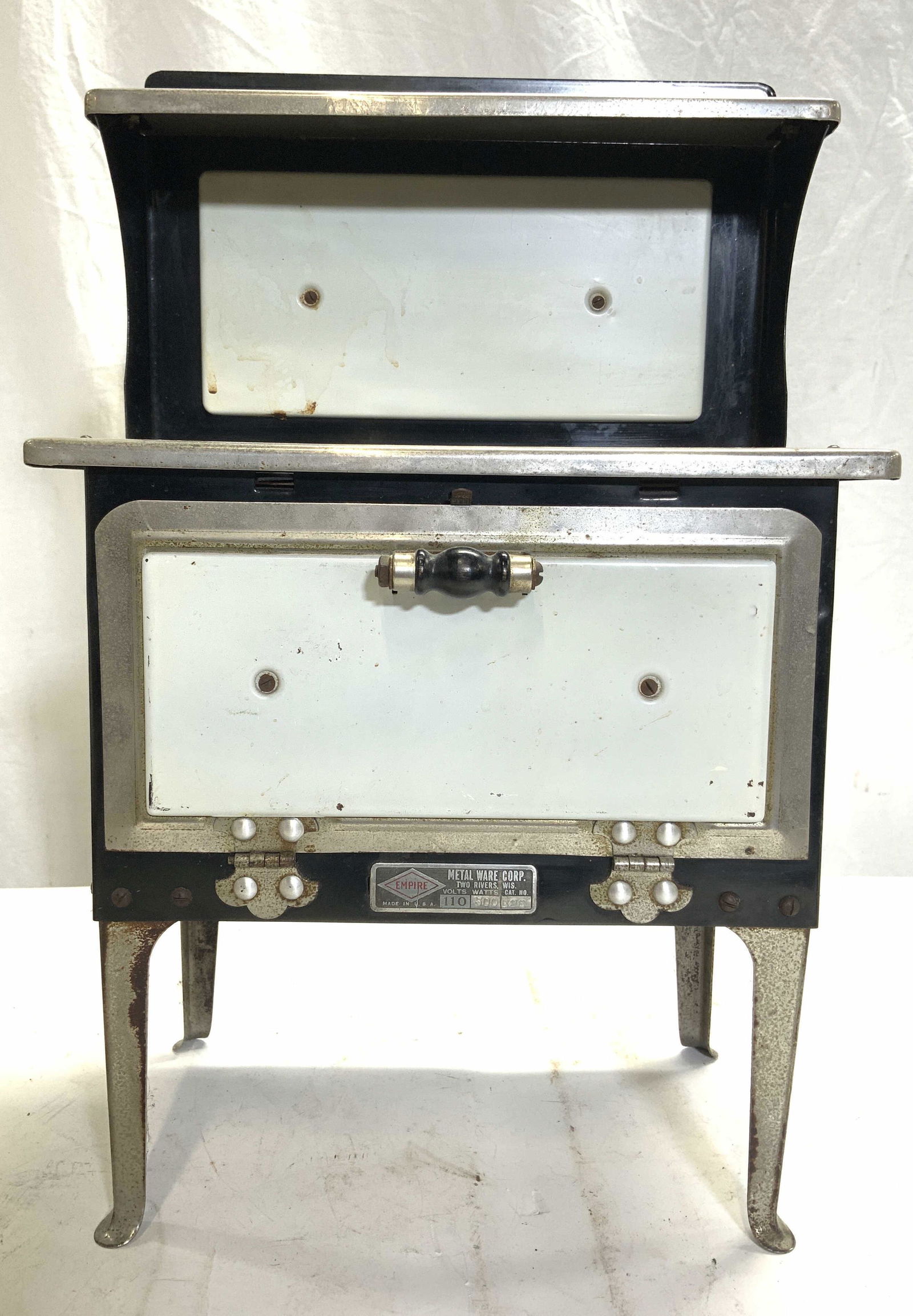 METAL WARE CORP Salesman Sample Stove: METAL WARE CORP Salesman Sample Stove with moveable parts. Stone is metal and enamel. Piece has burner area with pierced circular detail & moveable oven door detail with plug inside. Piece measures ap