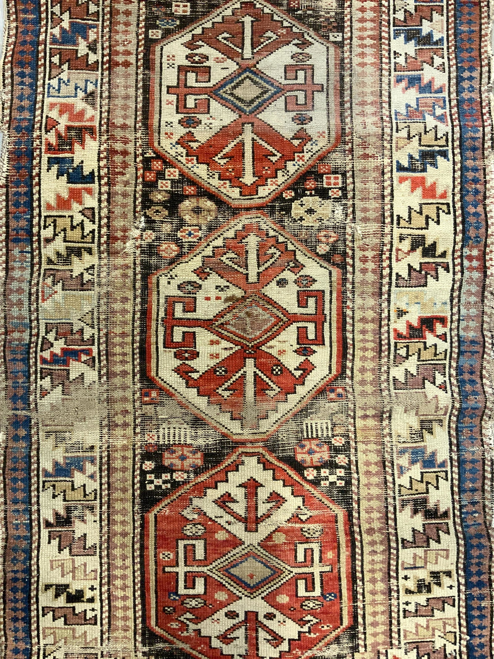 Vintage Handmade Turkish Wool Rug: Rug is handmade and wool. Piece has intricate multi toned geometric detail. Rug is vintage possibly antique. Rug appears to be Turkish. Piece measures approx 60 inches long 36 inches wide. Rug, carpet