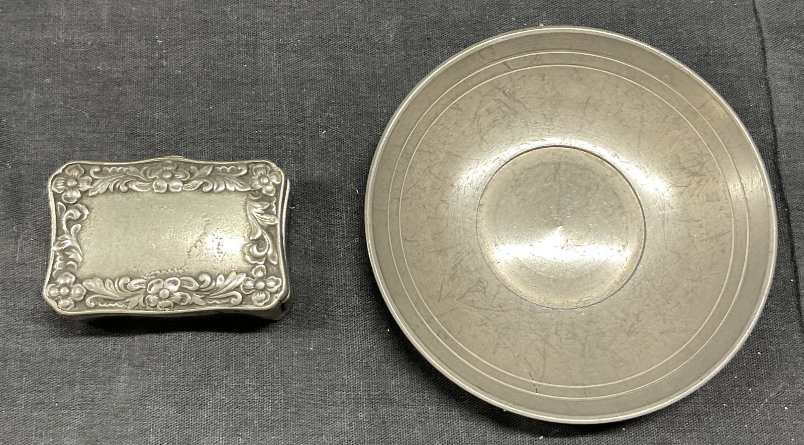 Lot 2 ZINN & MARGUEL Pewter Dish & Matchbox: Lot 2 ZINN & MARGUEL Pewter Dish & Matchbox, inscriptions read ‘ZINN 95%’, ‘MARGUEL SJ Delrei’, dish measures 4 inches in diameter, match box measures 5/8 x 2 1/4 inches, surface wear to piece