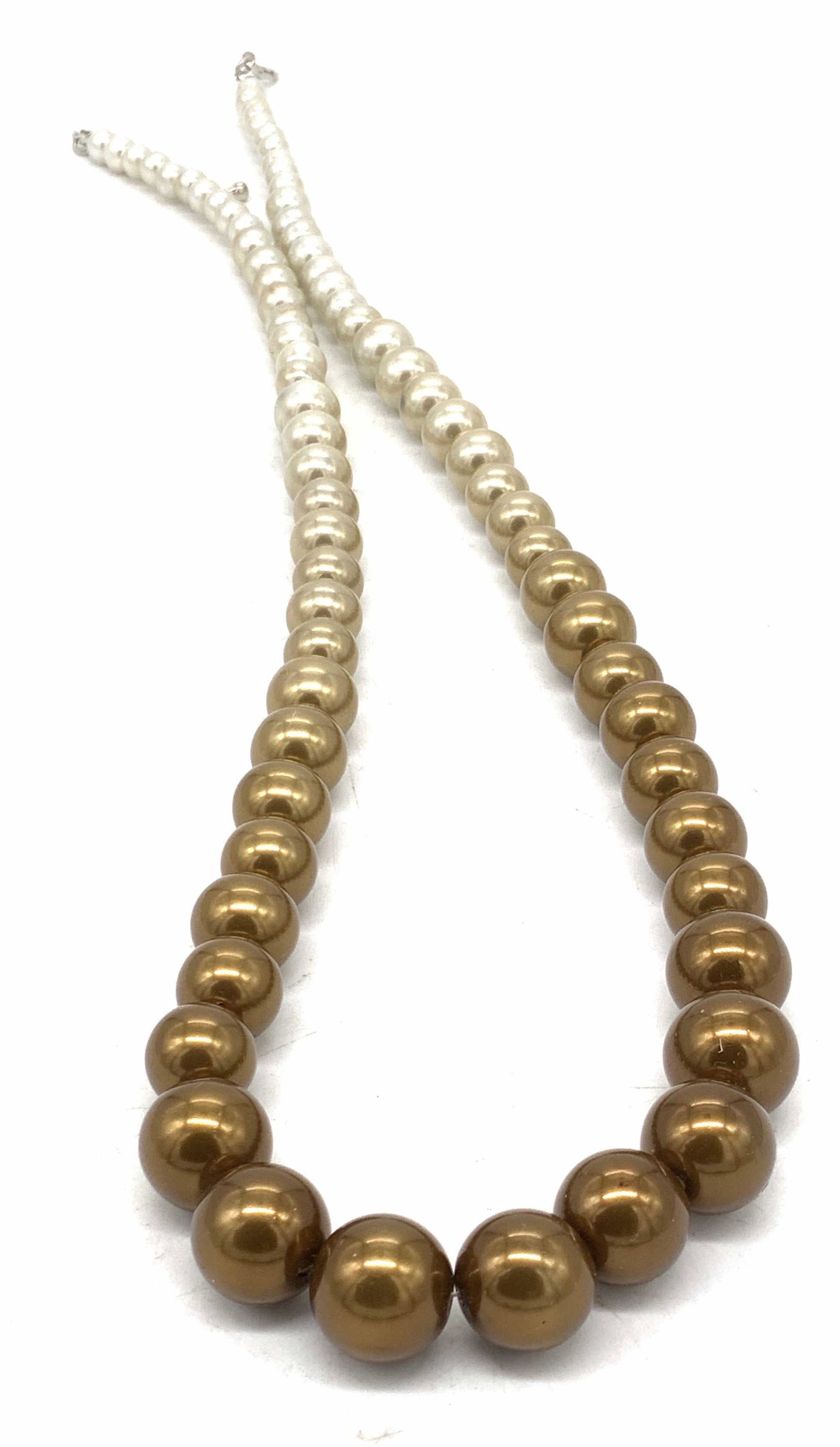 Tricolored Graduated Pearlescent Necklace, Jewelry: A ombre tricolored graduated pearlescent bead necklace. Secures with lobster claw clasp closure, crafted from silver tone metal. Necklace length Measures approx 27 in. Wear to adjustable chain, some s