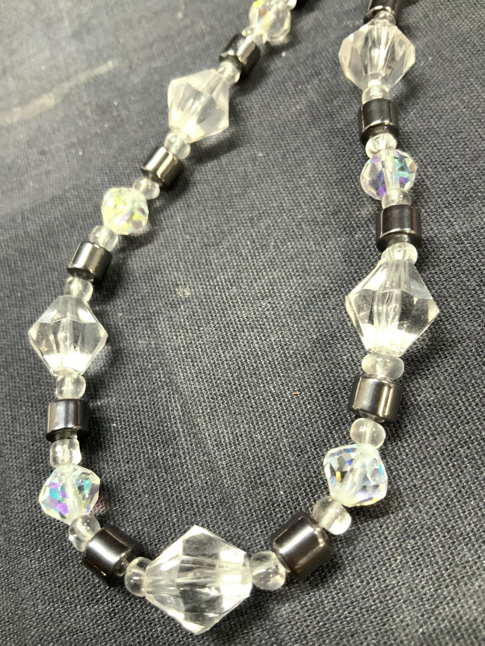 Bohemian Style Gemstone Choker Necklace: A choker necklace made up of faceted plastic and clear glass beads, along with metal toned beads. Screw clasps. Approximately 19 inches long. Bohemian style choker necklace, choker necklace, contempor