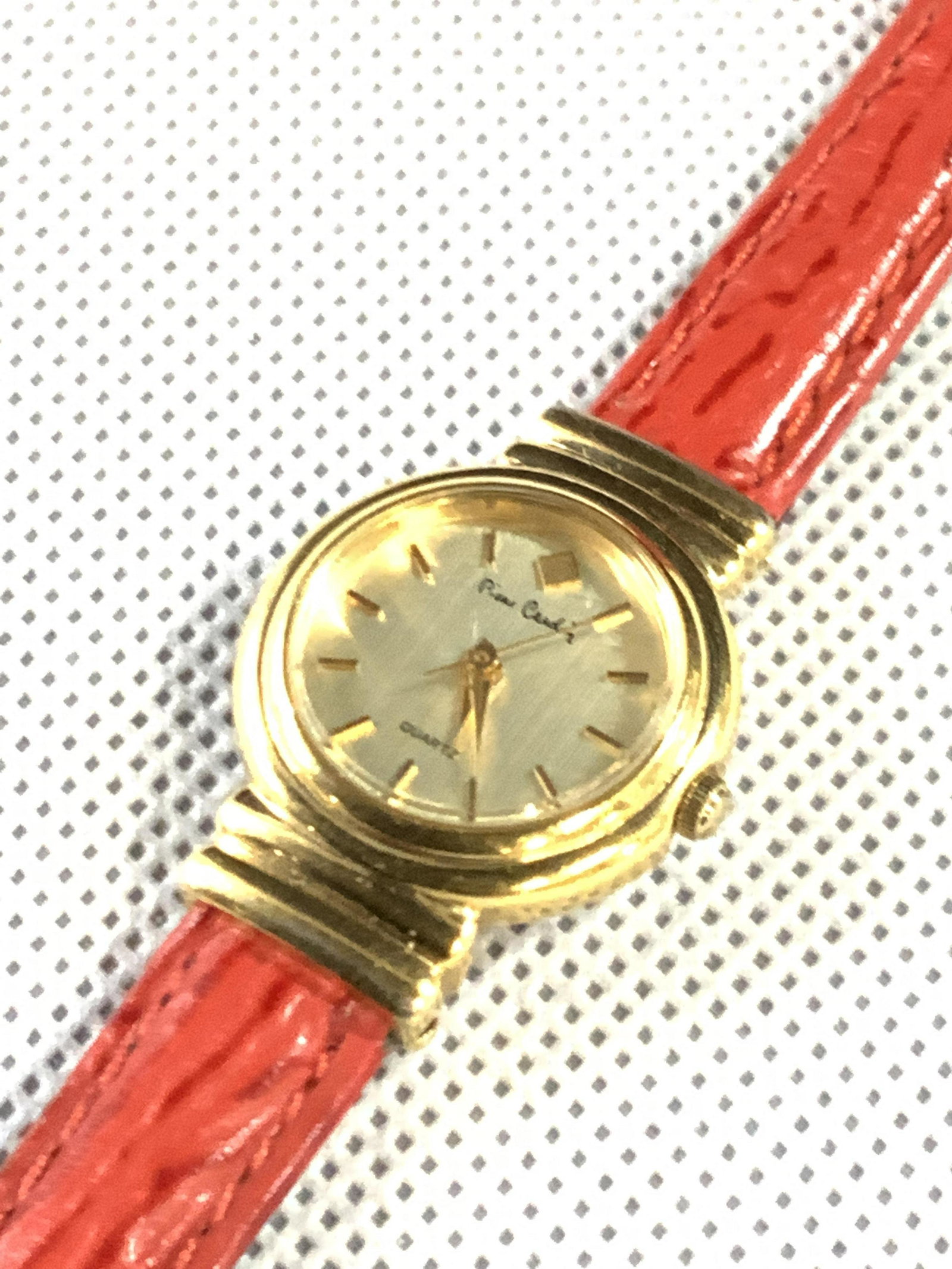 PIERRE CARDIN 14 KT Gold & Genuine Leather Watch: Wrist watch with a 14 Kt gold face, with a stainless steel backing. Face is marked Pierre Cardin, on face, and backside. Backside of face is marked Base Metal, bezel, Pierre Cardin, Stainless steel ba
