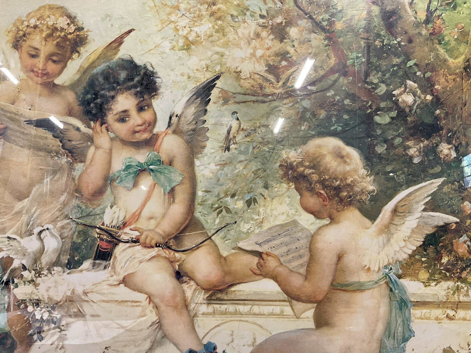 HANS ZATZKA Putto Offset Lithograph: HANS ZATZKA Putto Offset Lithograph, no apparent inscriptions or signatures to piece, not examined out of frame, subject three putti playing music, measures 22 1/8 x 28 1/4 inches, black metal frame, 