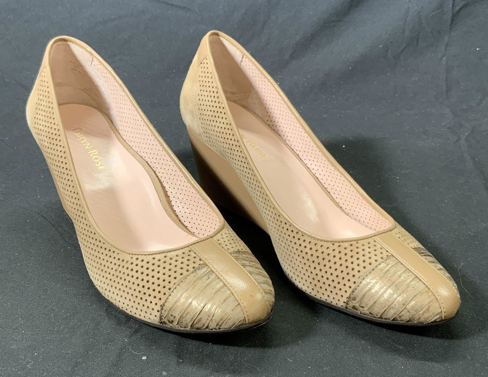 TARYN ROSE Beige Suede/Leather Wedge Heels: Taryn Rose beige wedge heels in perforated suede and leather detail toe. Size 7. Heel height approx. 2.5 inches. Some wear to soles. Taryn rose, Taryn rose shoes, ladies designer shoes, ladies designe