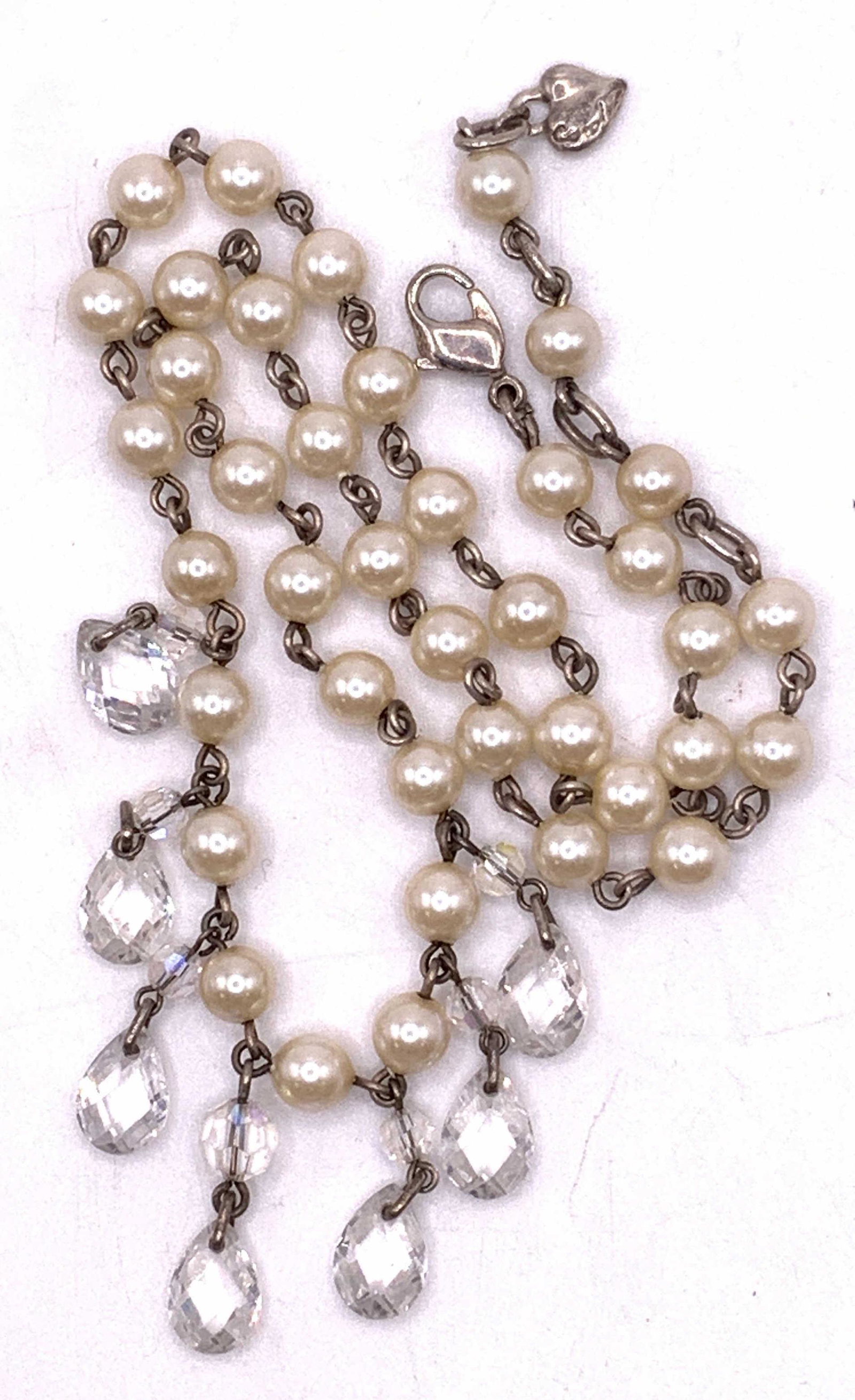 Vintage CAROLEE Pearlescent & Crystal Necklace: Carolee vintage pearlescent and crystal beaded choker necklace. Round pearlescent beads and teardrop shaped colorless faceted dangling crystals. Lobster claw clasp. Signed on necklace charm. Wear to f