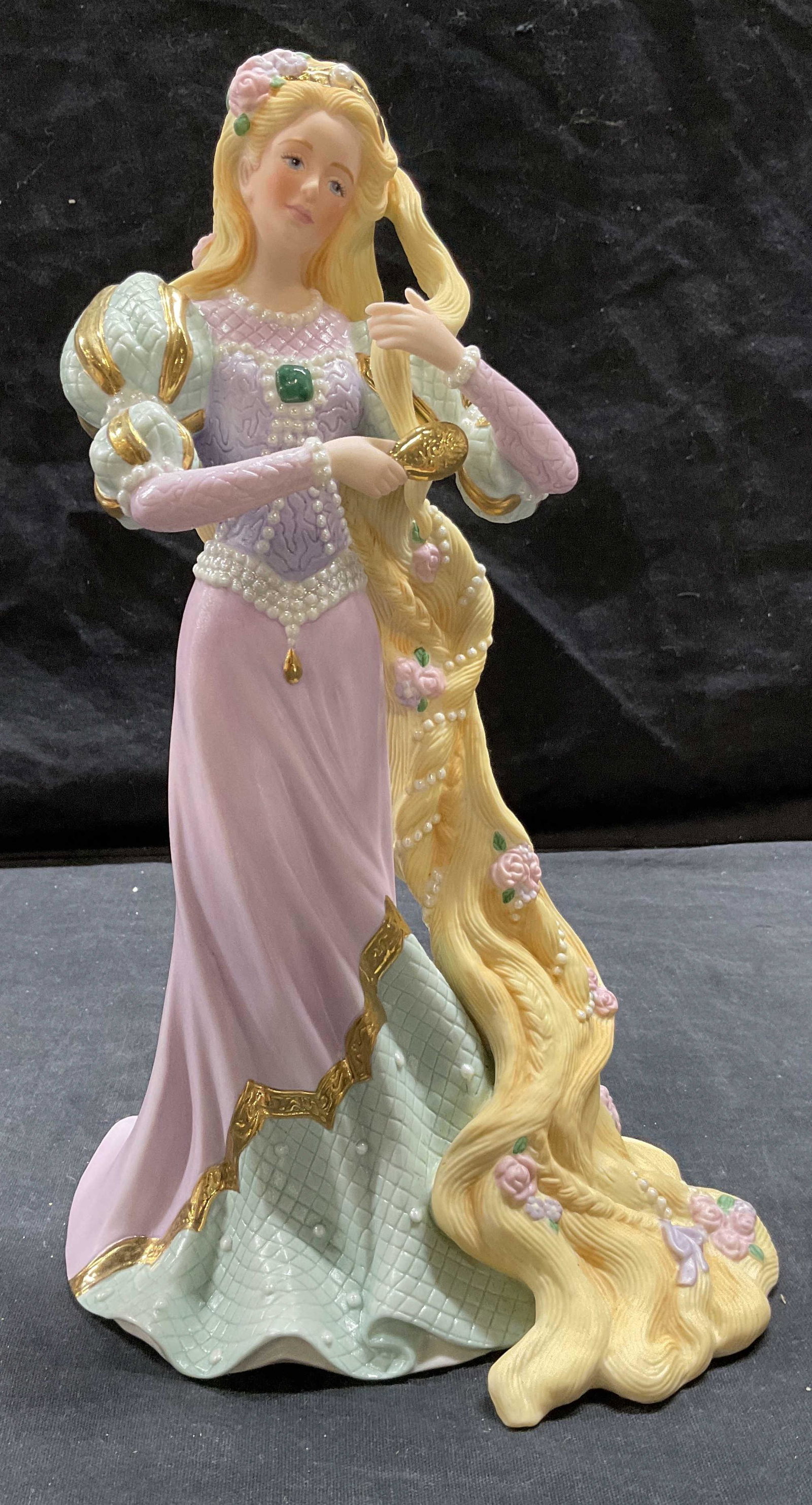 LENOX Porcelain Rapunzel Figurine: LENOX Porcelain Rapunzel Figurine, stamp to base reads Rapunzel Fine Porcelain Lenox 1996 Limited edition 1026, a blond woman brushing her hair, measures 9 7/8 inches tall x 6 3/8 inches wide at base,