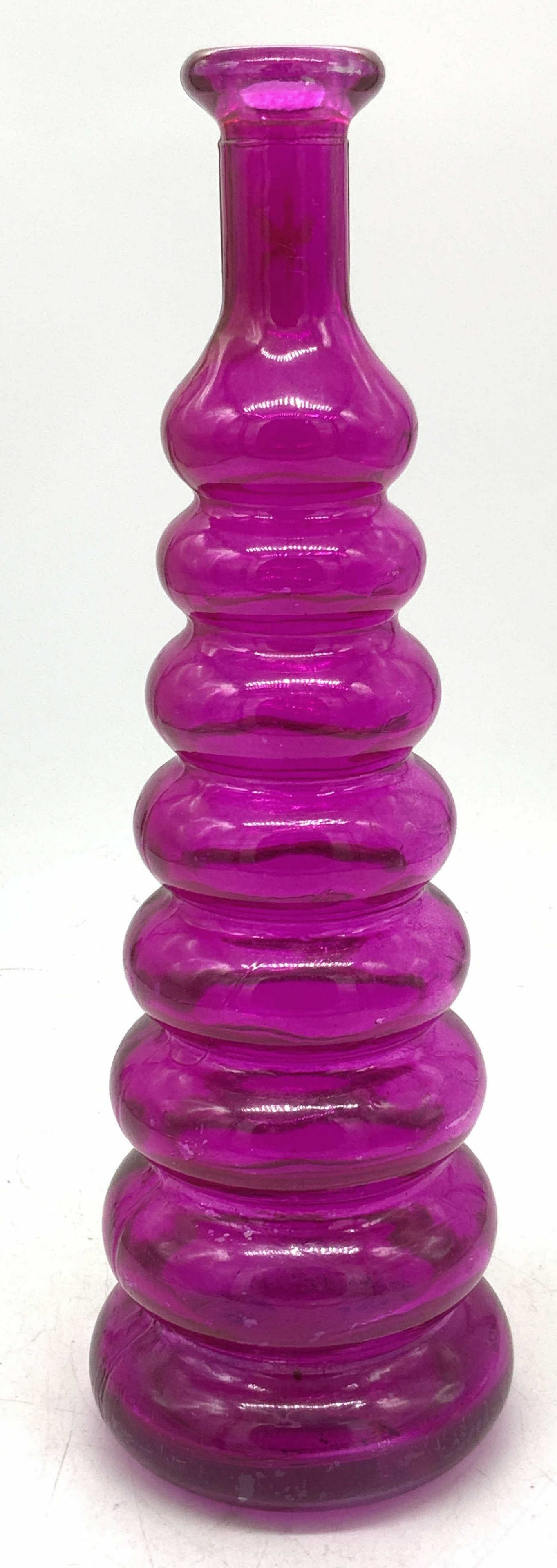 Vintage Tiered Magenta Toned Glass Vessel: A vintage glass vessel, magenta in color is a tapered shape with rounded tiers going up the vessel. Approximately 12 inches tall. Property of Palm Beach, Fl Estate. Vintage glass decor, vintage glass 