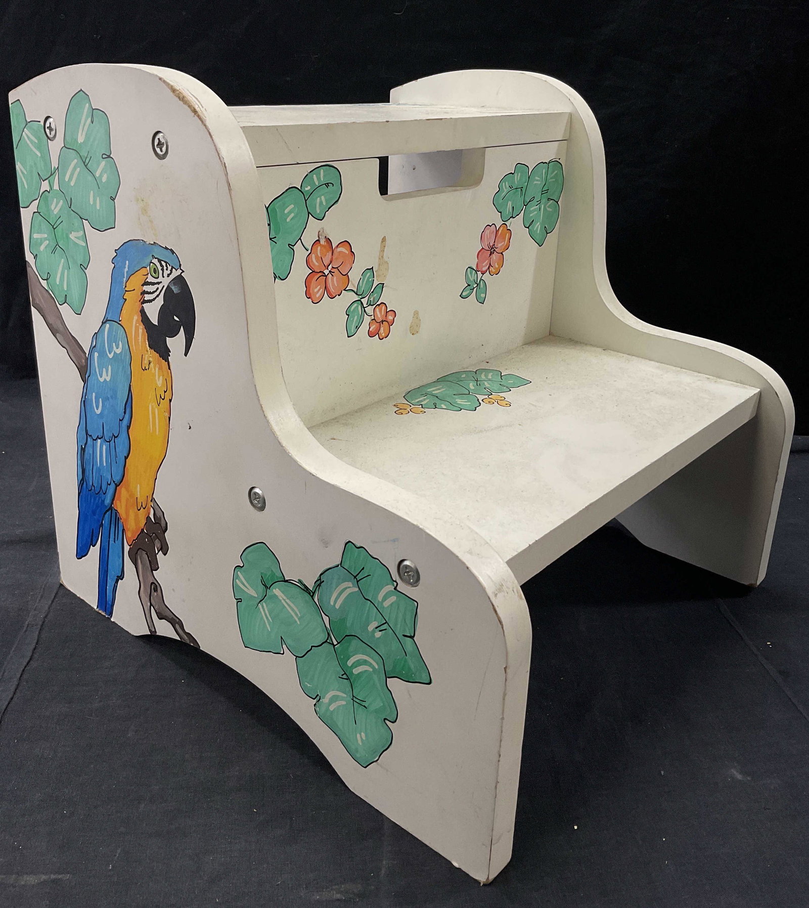 Hand Painted Tropical Kids Bathroom Step Stool: Kids bathroom step stool with painted parrots to each side. Painted foliage as well. Tag to back reads The Kids Korner. Measures approx 13H x 13W x 13.5D inches. Surface wear to piece consistent with 