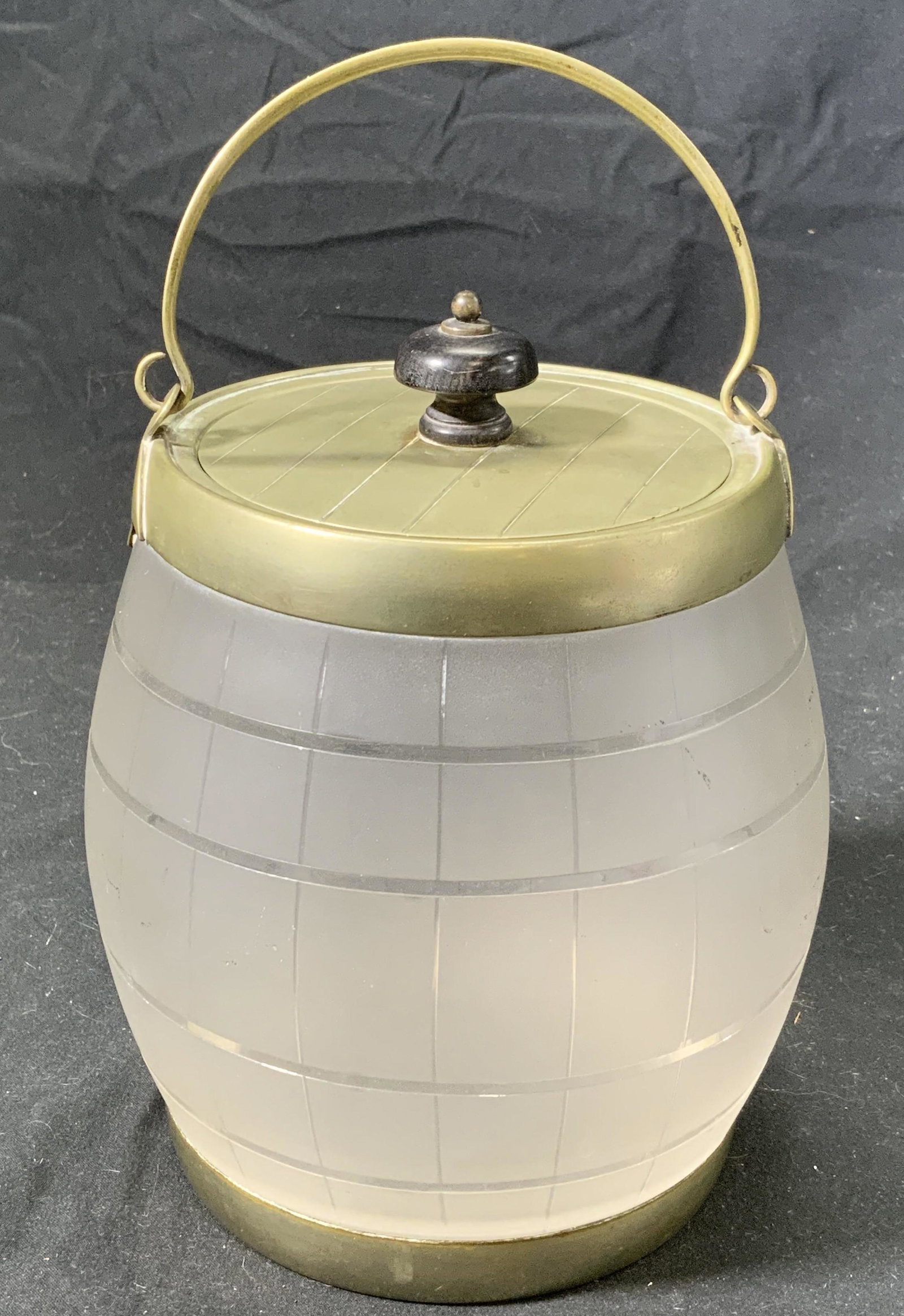 Vintage Lidded Glass Tobacco Jar: A vintage lidded glass tobacco or biscuit jar. In good condition. Some surface wear. Measures approx. 5.5 inches diameter and 6.5 inches tall. Property of Palm Beach, Fl Estate. Tobacco jar, biscuit j
