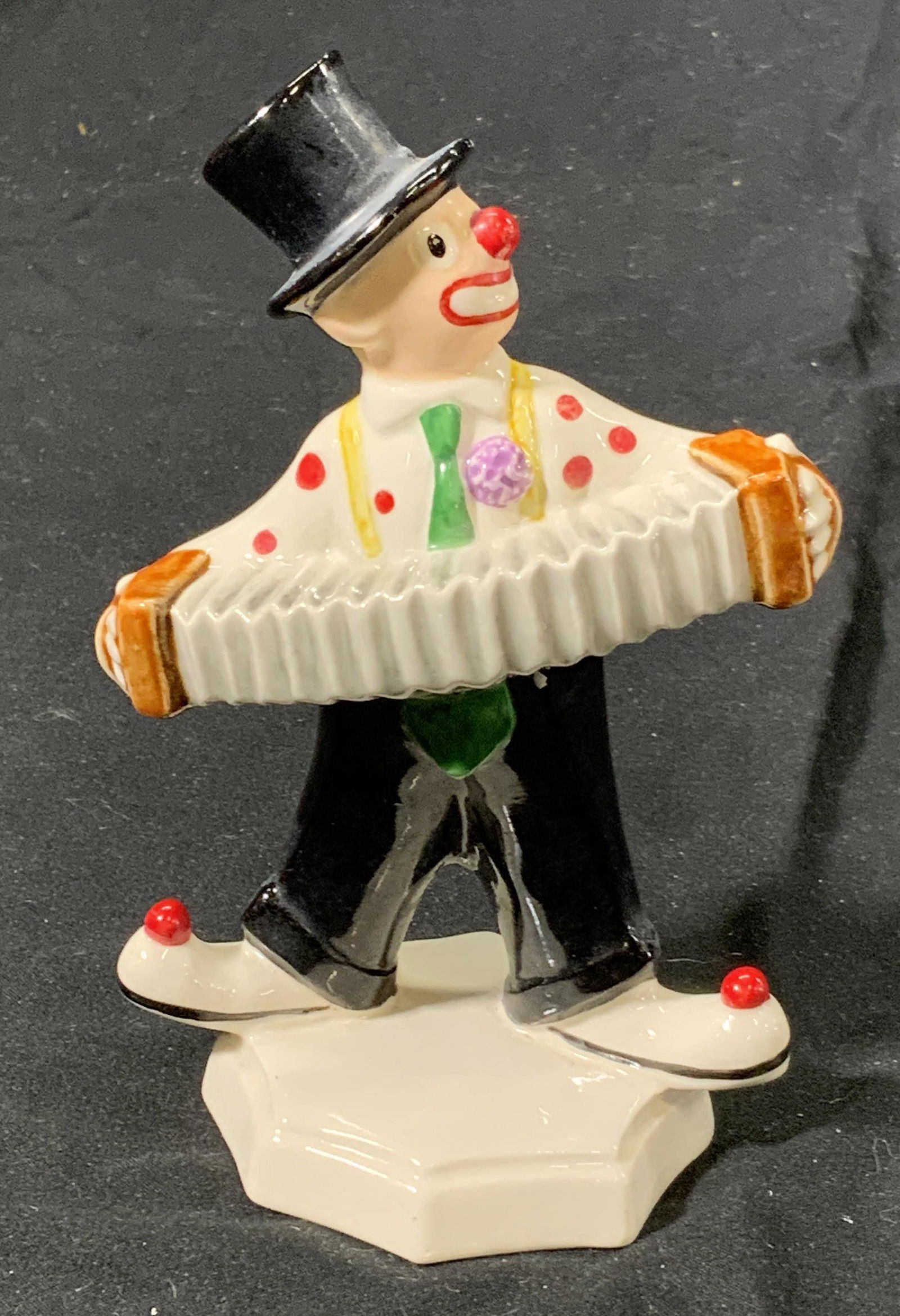 GOEBEL Vintage Porcelain Clown Figurine, Germany: Vintage signed GOEBEL porcelain figurine of a clown with an accordion. Vintage condition, needs cleaning. Measures approx. 3.75 x 2.25 x 5.5 inches. Signed to underside. Property of Palm Beach, Fl Est