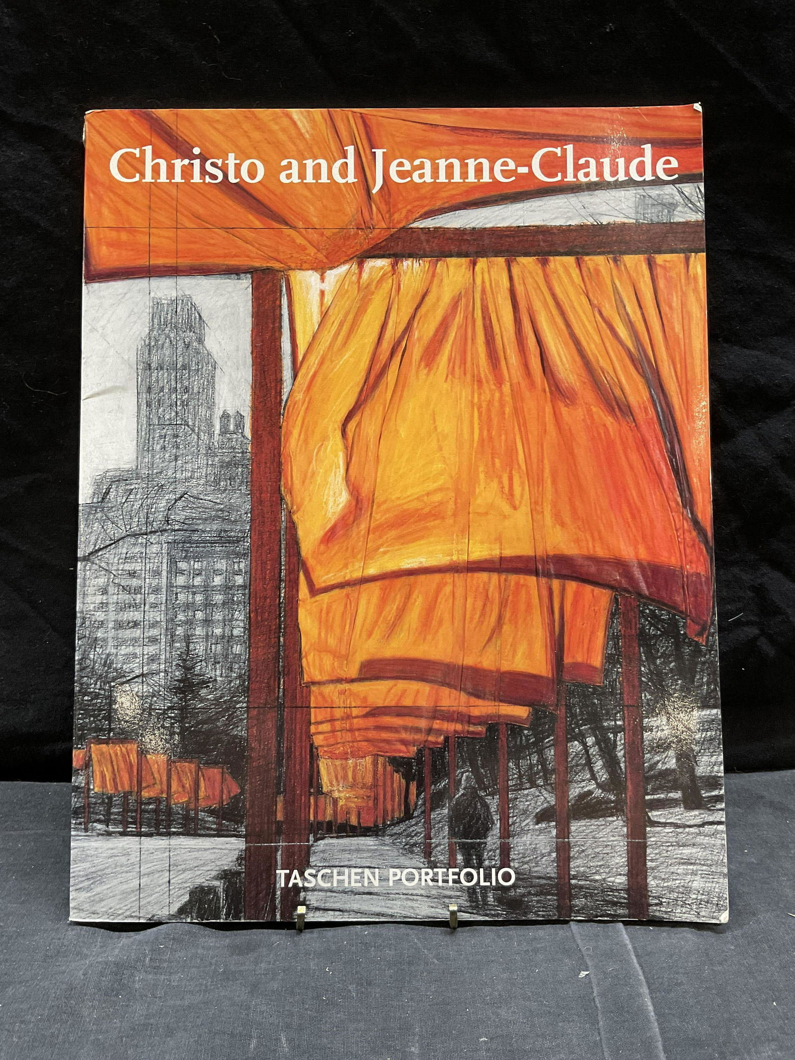 Christo & Jeanne Claude The Gates Book: Christo & Jeanne Claude The Gates Book, inscription to cover reads Christo and Jeanne-Claude Taschen Portfolio, measures 14 1/4 x 11 1/4 inches, folds to paper and surface wear to cover, some pages lo
