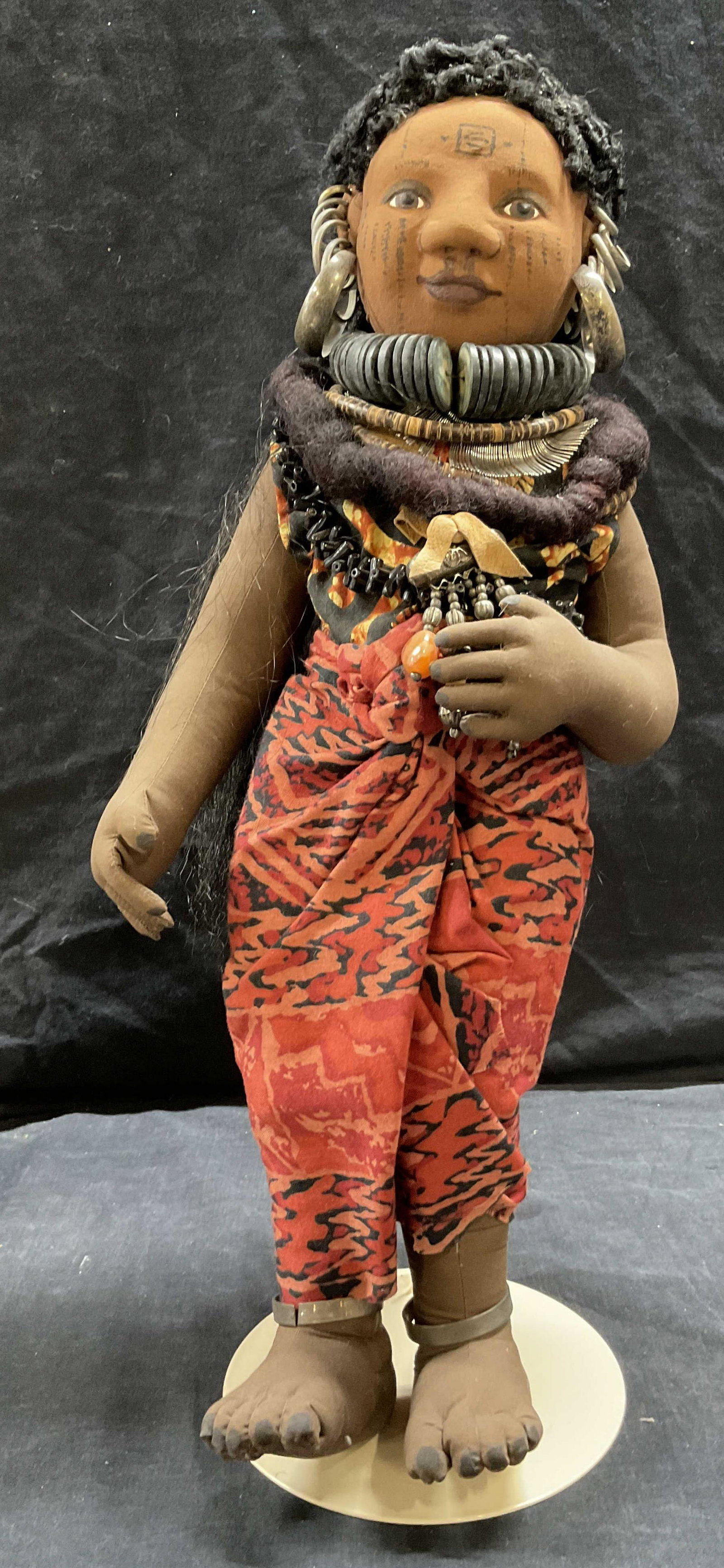 African Inspired Cloth Doll: African Inspired Cloth Doll, inscription to base reads Playhouse Taiwan, a cloth doll with ornamental jewelry, measures 19 inches tall x 8 inches wide, wear to doll, Cloth doll, fabric doll, collectib