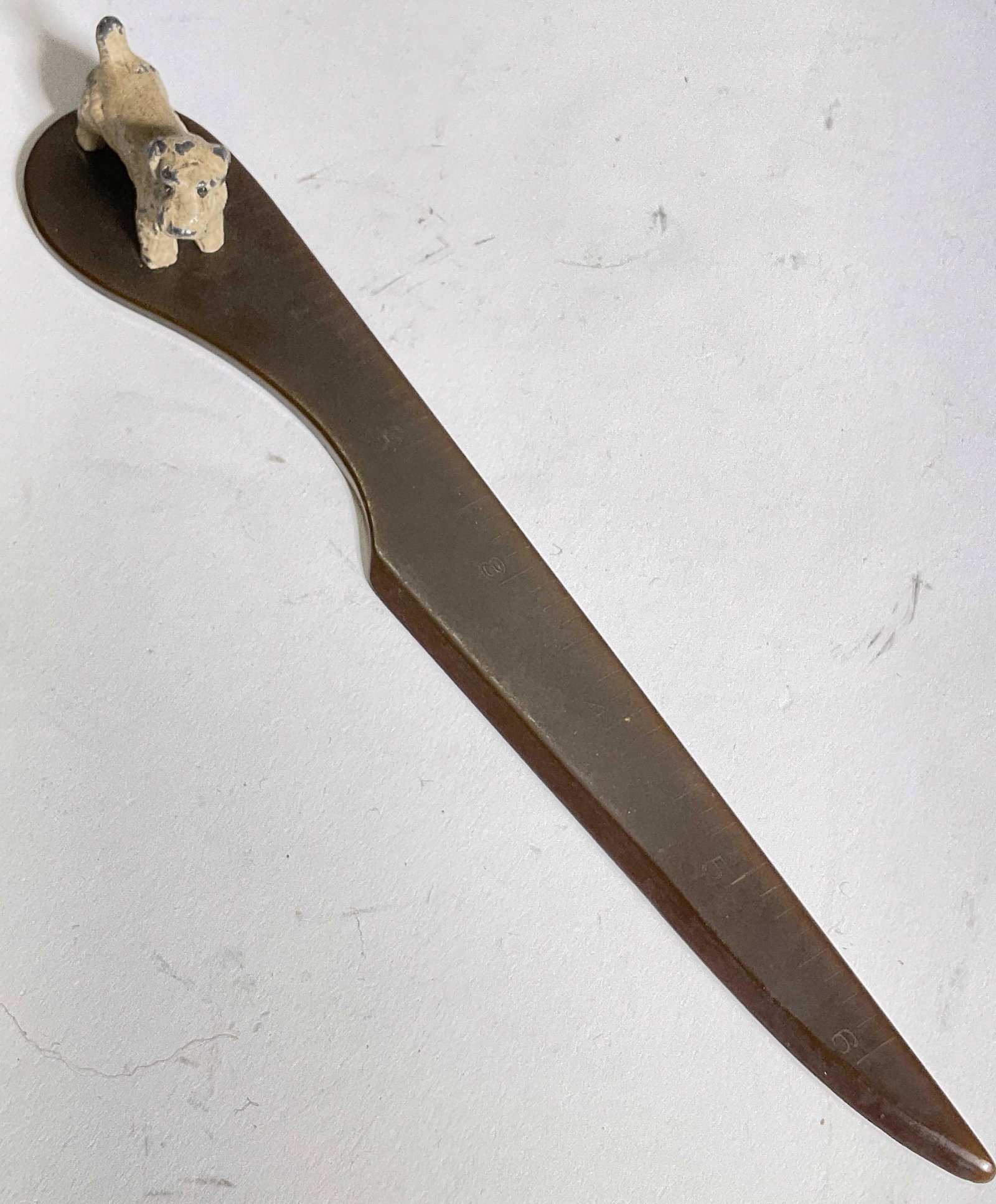 Hershey Derby Conn Letter Opener W Ruler: Letter opener w ruler. Metal dog attached to end as a weight. Measures approx 8L x 1H. Surface wear to piece consistent with age and use. Bottom reads Hershey Derby Conn. Property of Palm Beach, Fl Es