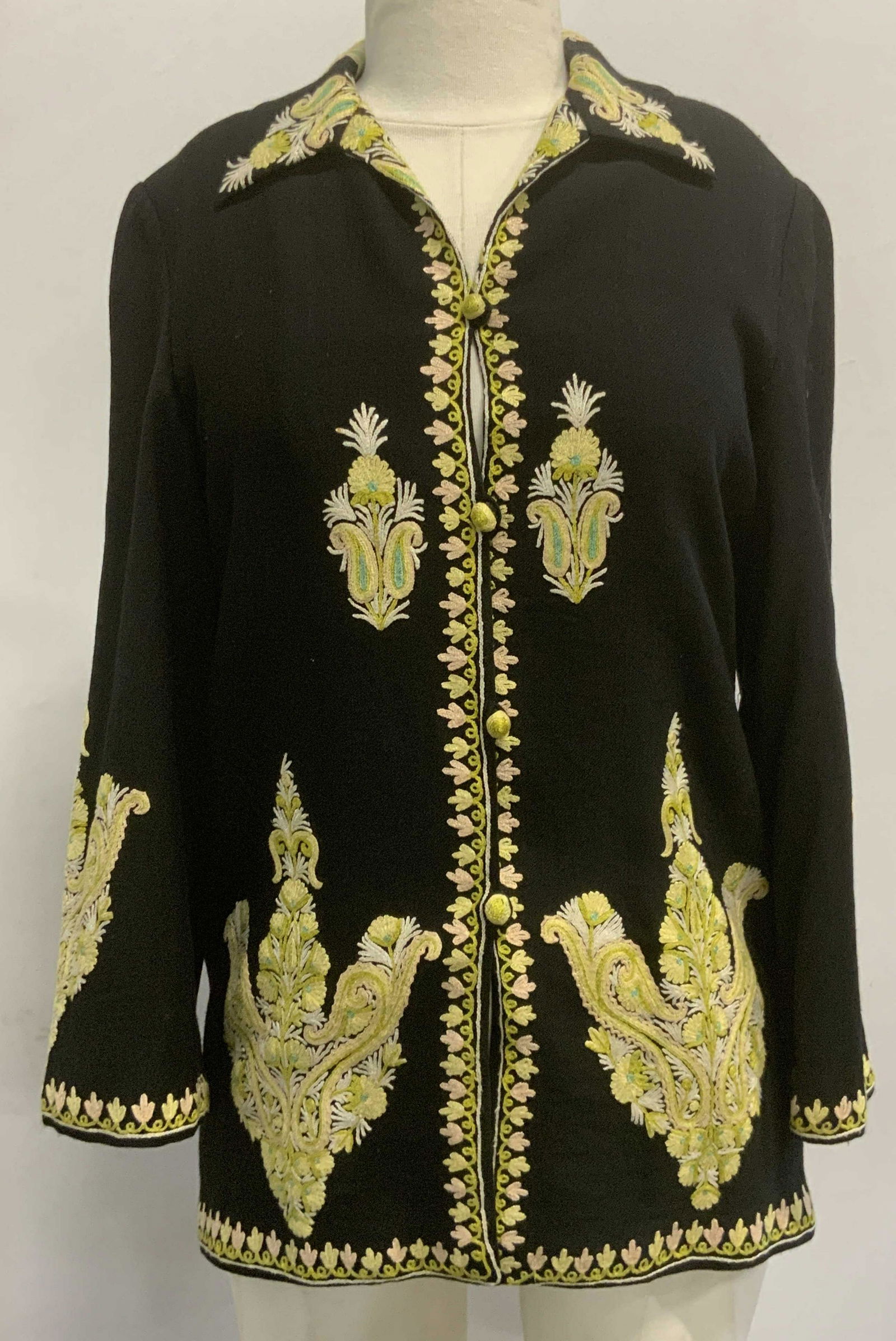 Embroidered Fabric Button Cardigan: Embroidered Fabric Button Cardigan, black with green embroidery, knit exterior with blend lining, material unknown, measures approx 25 x 17 in. Embroidered fabric button cardigan, ladies cardigans, la