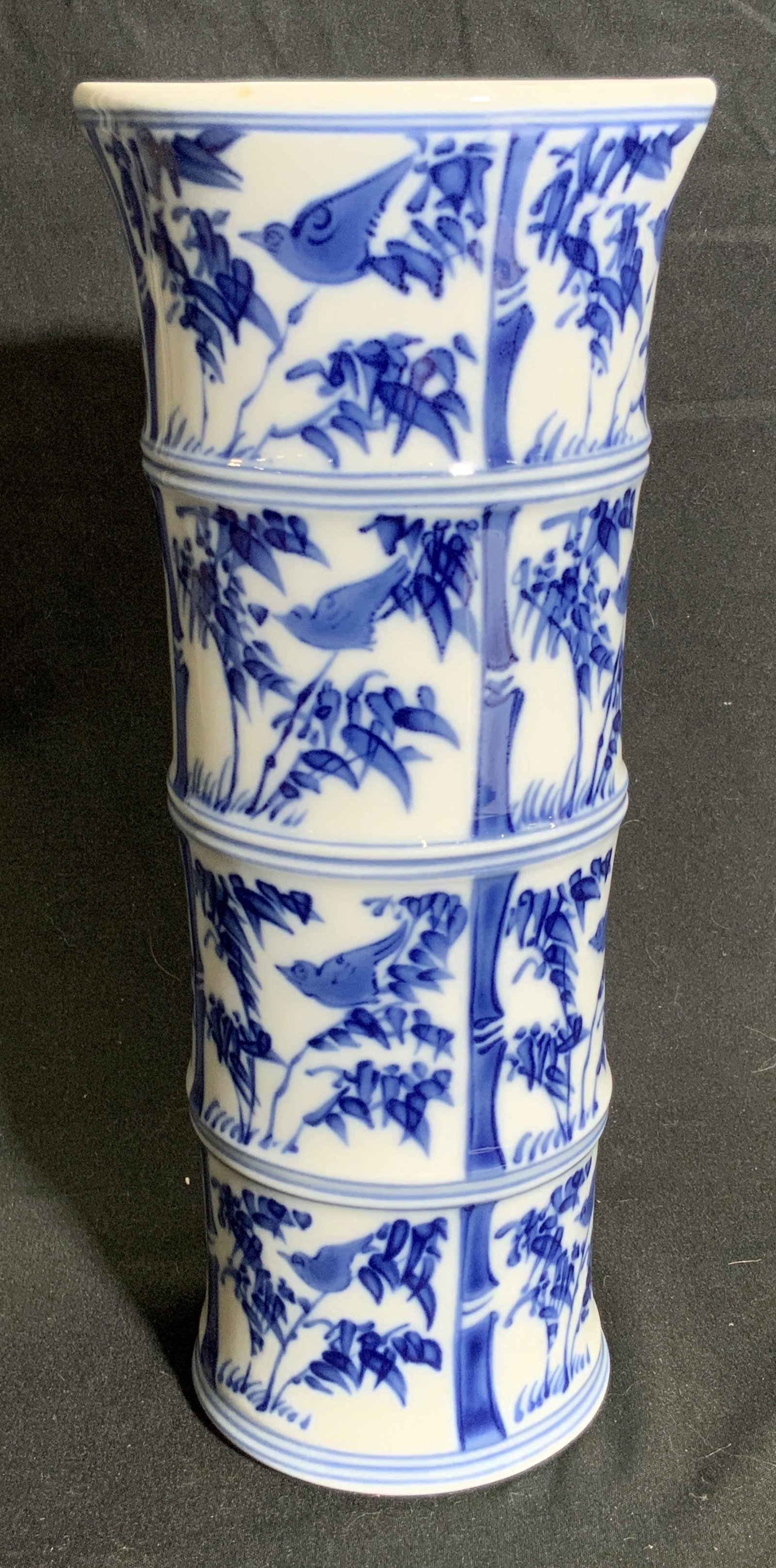 MOTTAHEDEH Signed Blue & White Porcelain Vase: A blue and white porcelain vase decorated with birds, bamboo, and foliage. Underside reads MOTTAHEDEH VISTA ALEGRE PORTUGAL. Measures approx 9H x 3.5W in. Some wear consistent with use, including wear