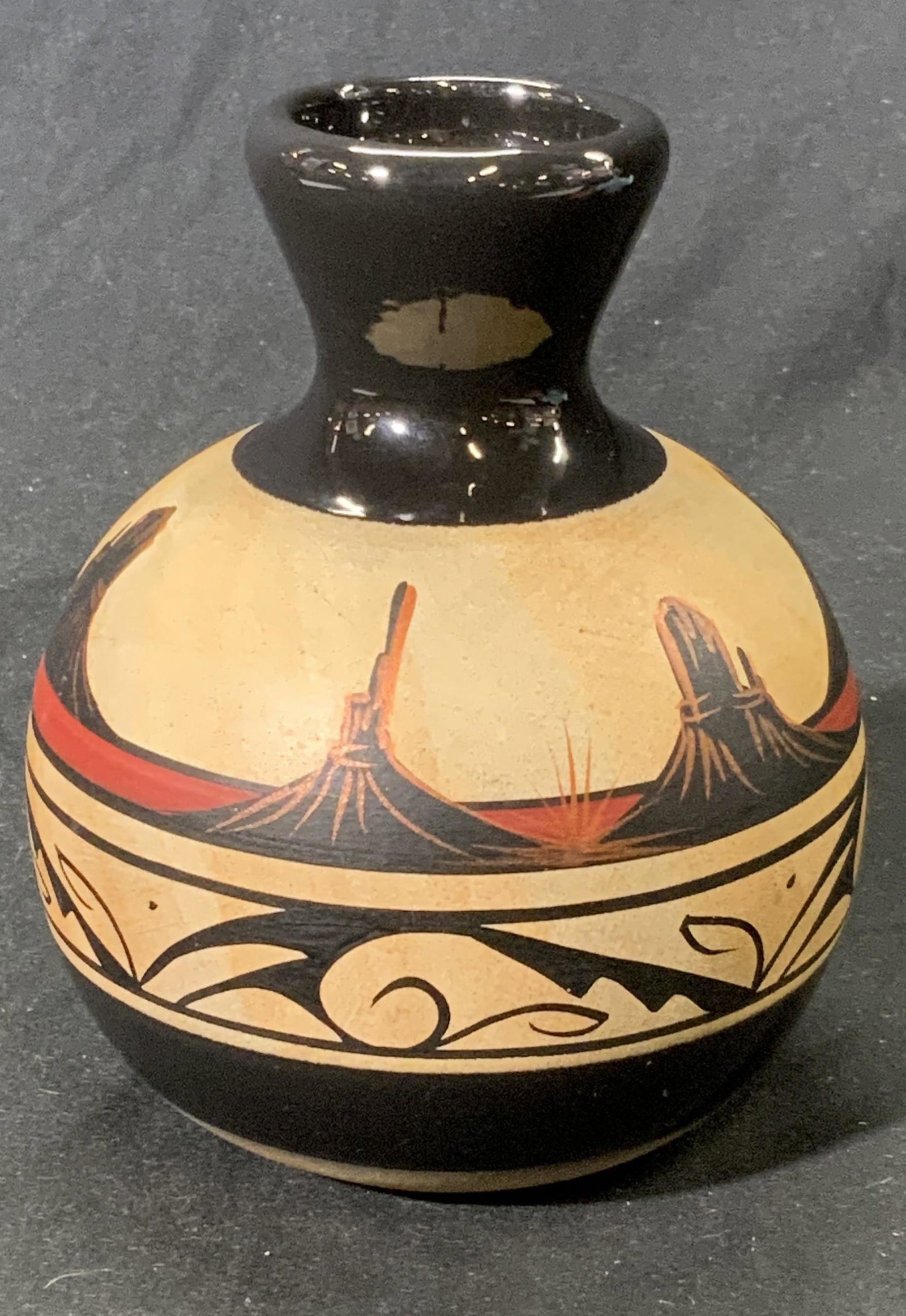 Attr JULIA BLACKHORSE Binishtaa Navajo Pottery: Attributed to Julia BLACKHORSE Binishtaa Navajo vase/pottery. Hand painted. In good condition. Signed on underside BINISHTAA NAVAJO. Measures approx. 5 inches wide and 5.75 inches tall. Property of Pa