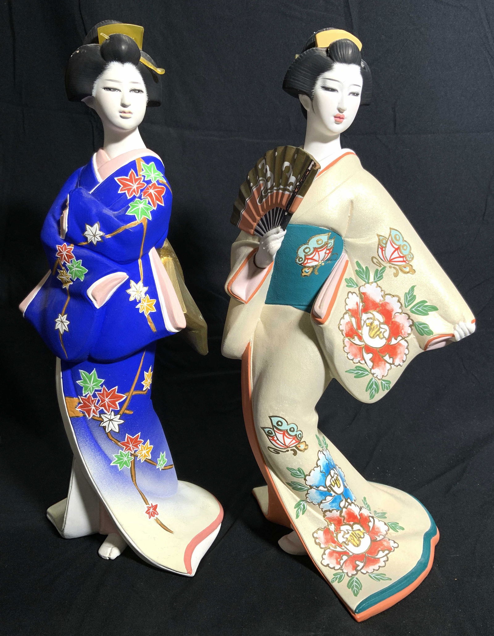 Lot 2 HAKARA BISQUE DOLLS: Lot includes 1 MAPLE LEAF MAIDEN OF FALL doll and 1 PEONY MAIDEN OF SUMMER doll. Each piece depicts a geisha figure. One is holding hand fan. Largest piece measures approx 15 inches tall 7 inches wide