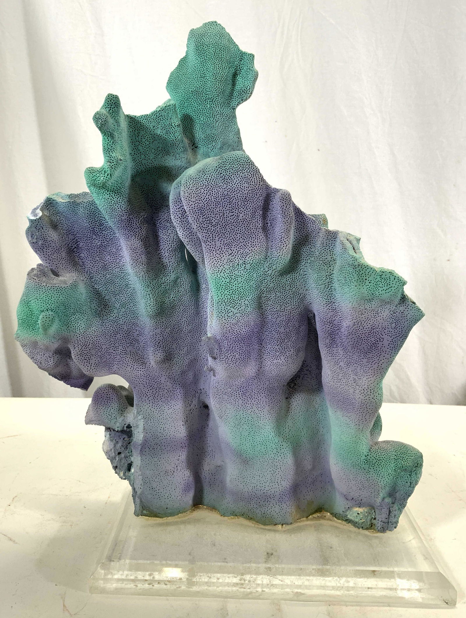 Coral Sculpture On Acrylic Base: Sculpture appears to be coral, possibly composite. Piece has tones of lavender & teal. Base is clear, appears to be acrylic, possibly lucite. Piece measures approx 14.5 inches tall 11.5 inches wide 5.