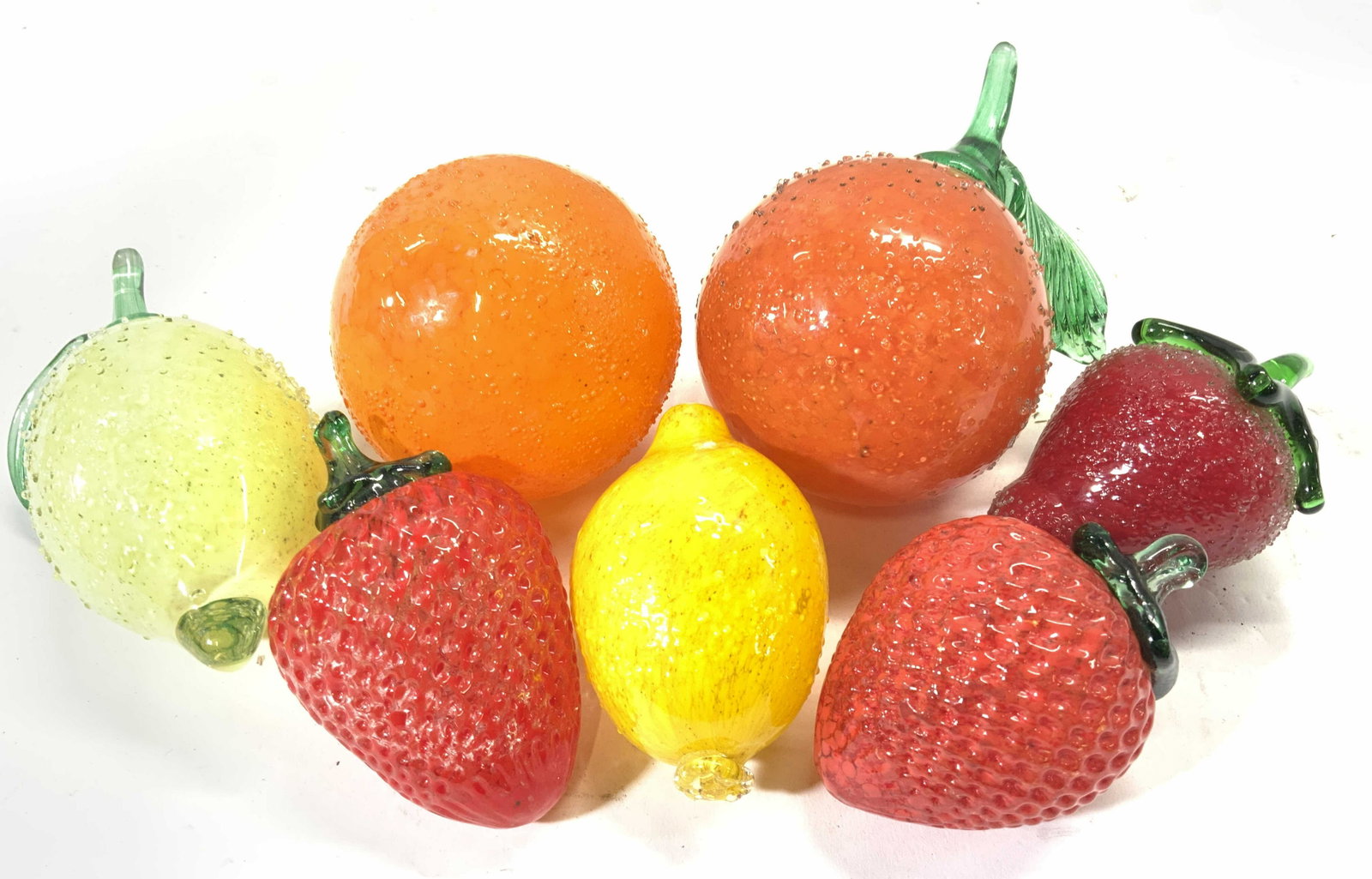 Lot 7 Art Glass Fruit Figure: Lot includes 3 strawberries, 2 lemons, & 2 orange figures. Orange figure measures approx 4.5 inches tall with leaf 3 inches wide. Art glass, Art glass fruits, glass fruits, decorative accessories, dec