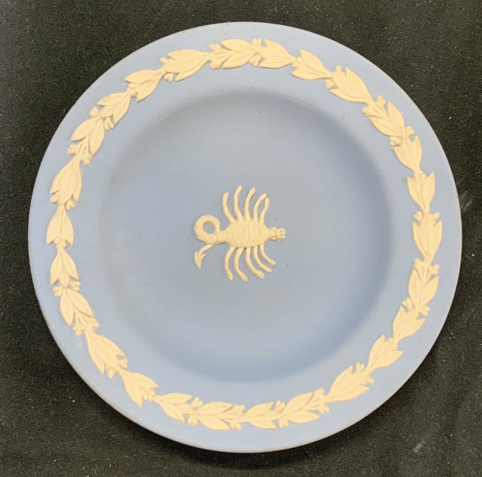 WEDGWOOD Vintage Blue Jasperware Scorpion Pin Tray: Vintage signed Wedgwood blue Jasperware pin tray with scorpion cameo relief. Some surface wear consistent with age, use, and exposure. Measures approx. 4.5 inches diameter. Signed and trademarked to u