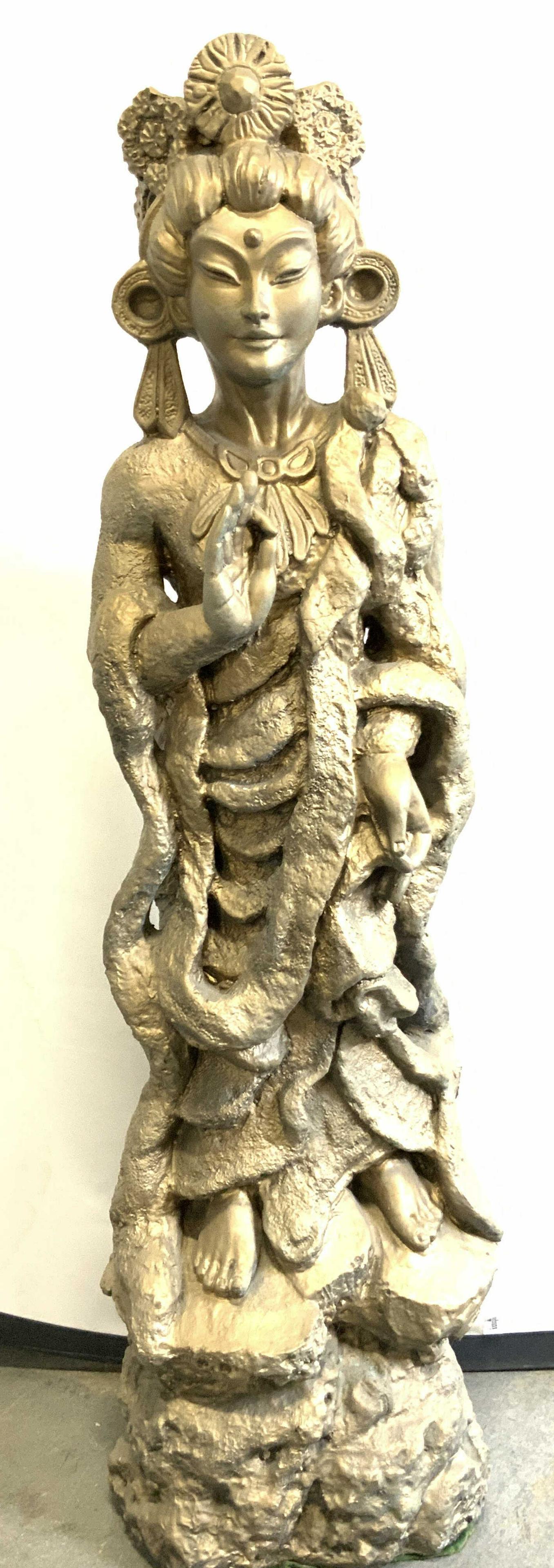 XL Guan Yin Plaster Sculpture 35inH: 35 Inch tall heavy weight possibly plaster made sculpture depicting a female deity with head dress, large earrings. Hands of sculpture depict one hand upward and one hand pointed downward, sculpture i