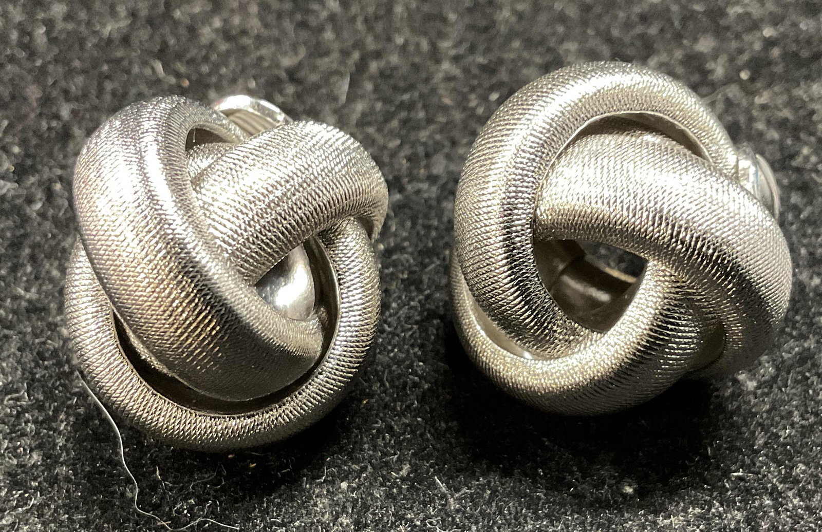 Vintage MONET Knot Clip Back Earrings: Vintage MONET Knot Clip Back Earrings, inscriptions read Monet, each measures 3/4 inches in diameter, surface wear to pieces, Property of Palm Beach Estate, Vintage, vintage jewelry, clip on earrings,