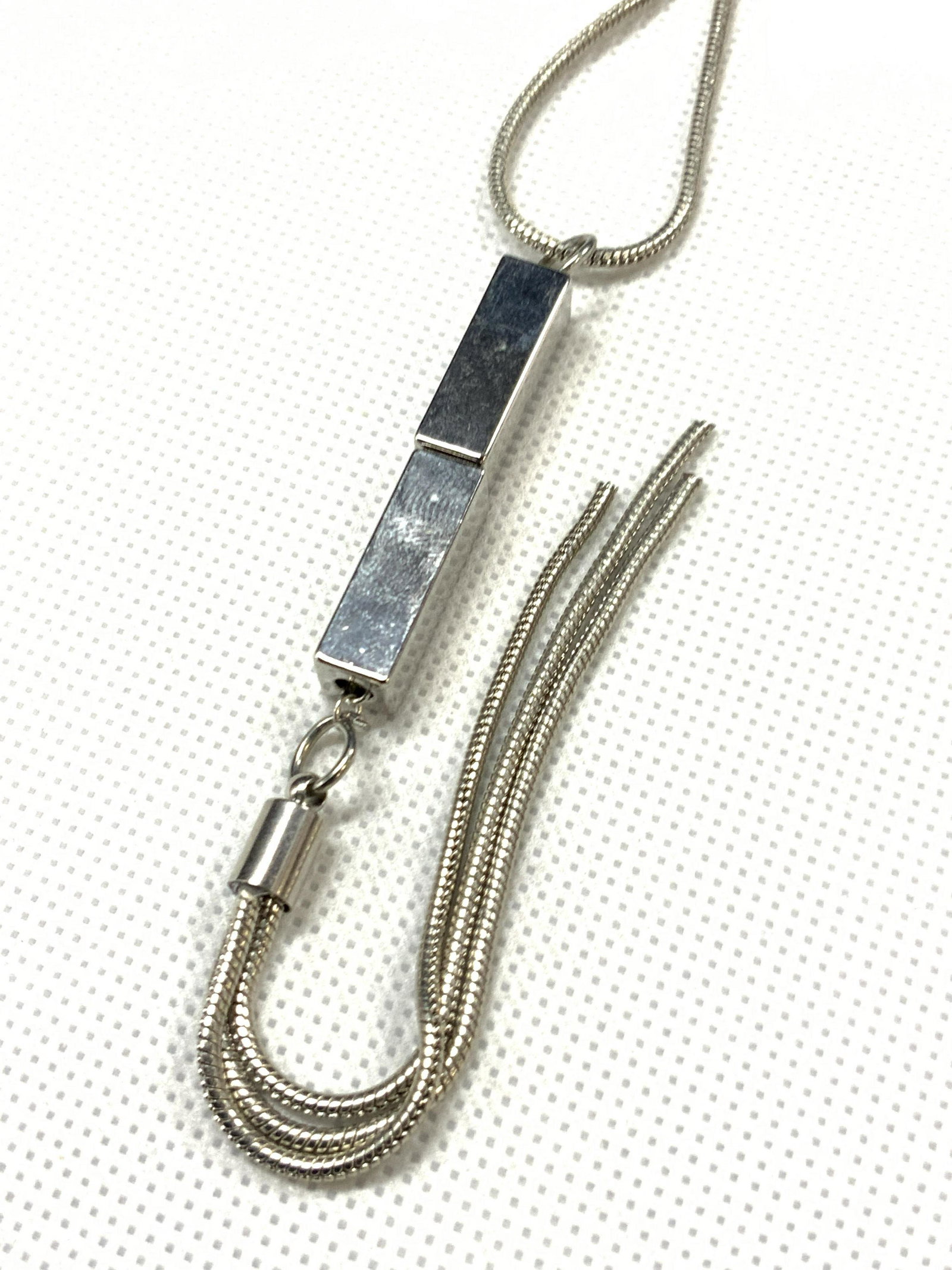 Art Deco Rope Tassel Necklace: A silver toned rope length neck with Art Deco rectangular beads before the chain tassel. Approximately 20 inches long. Art Deco tassel necklace, tassel necklace, rope necklace, contemporary jewelry,Es