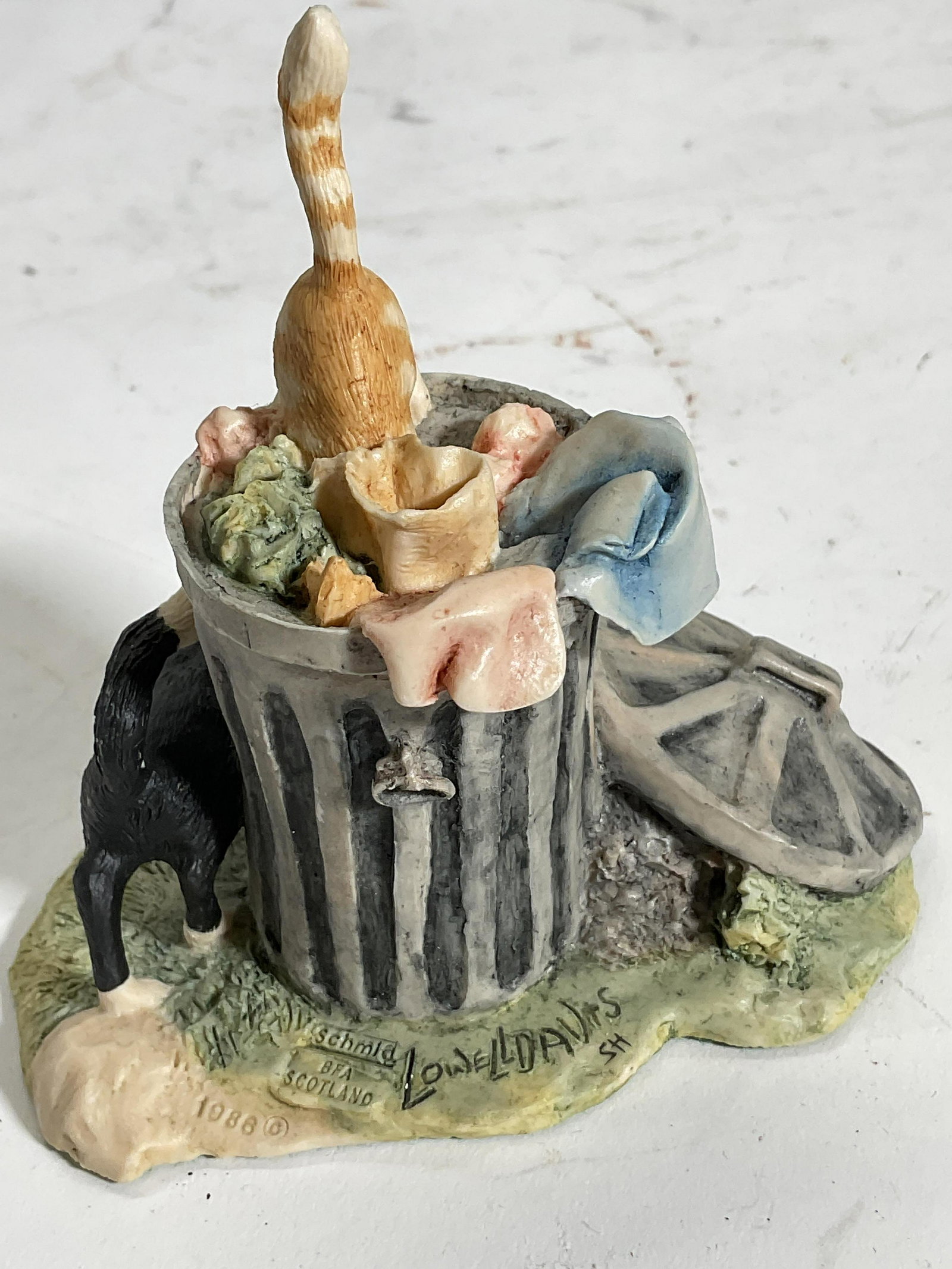 Cats In Trash Figurine, Border Fine Art, Scotland: Cats in trash hand made in SCOTLAND by Border Fine Arts in 1986. Bottom is felted and labeled, Signed on top. Measures approx 4H x 4W inches. No visible wear to piece. Border Fine Arts was founded in 